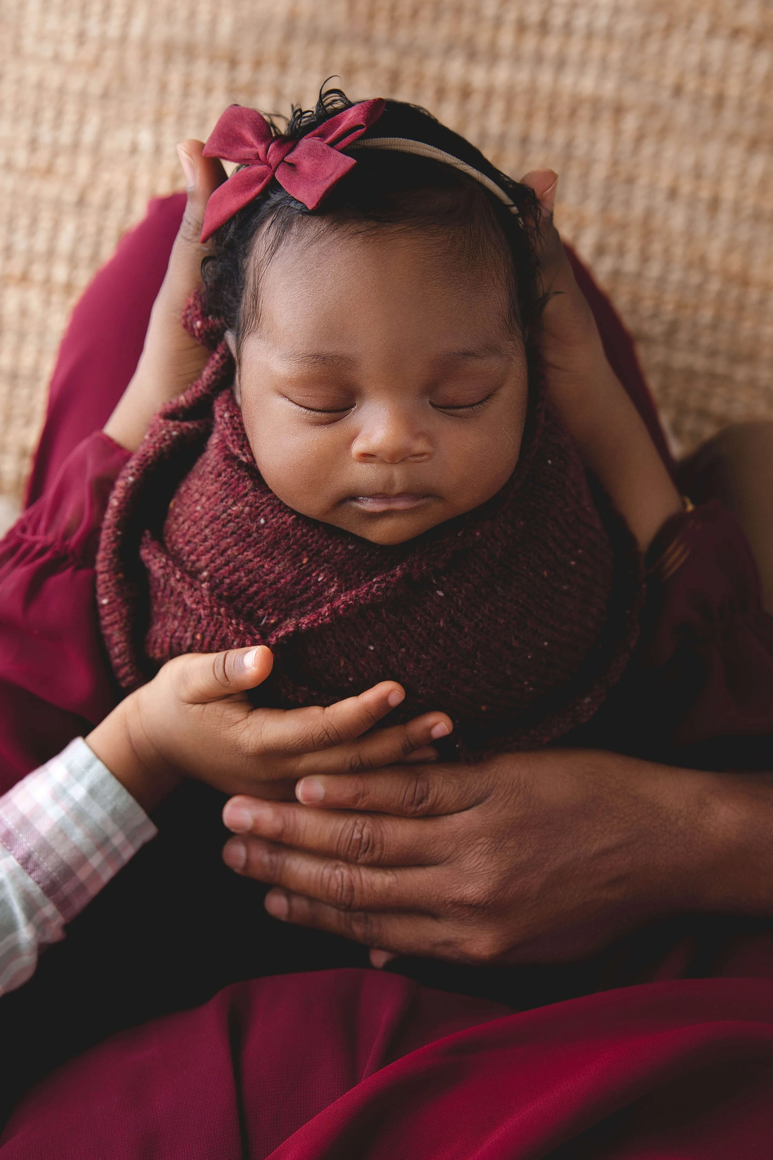 baby wrapped in red