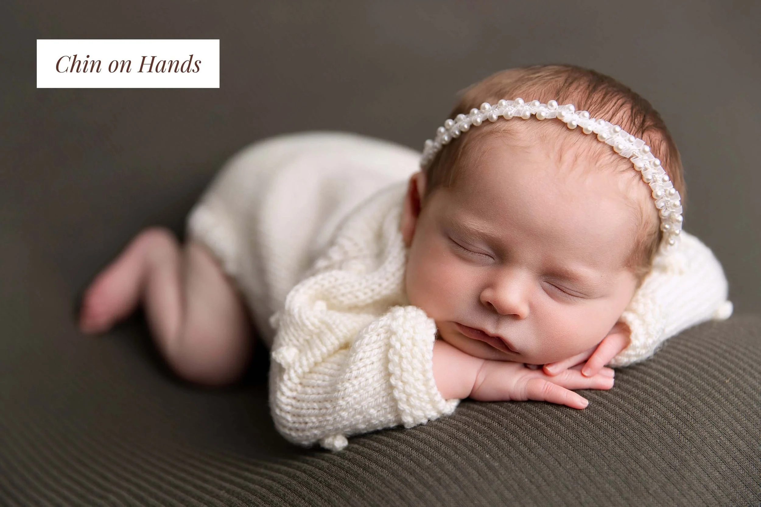 Baby posed in a traditional newborn pose