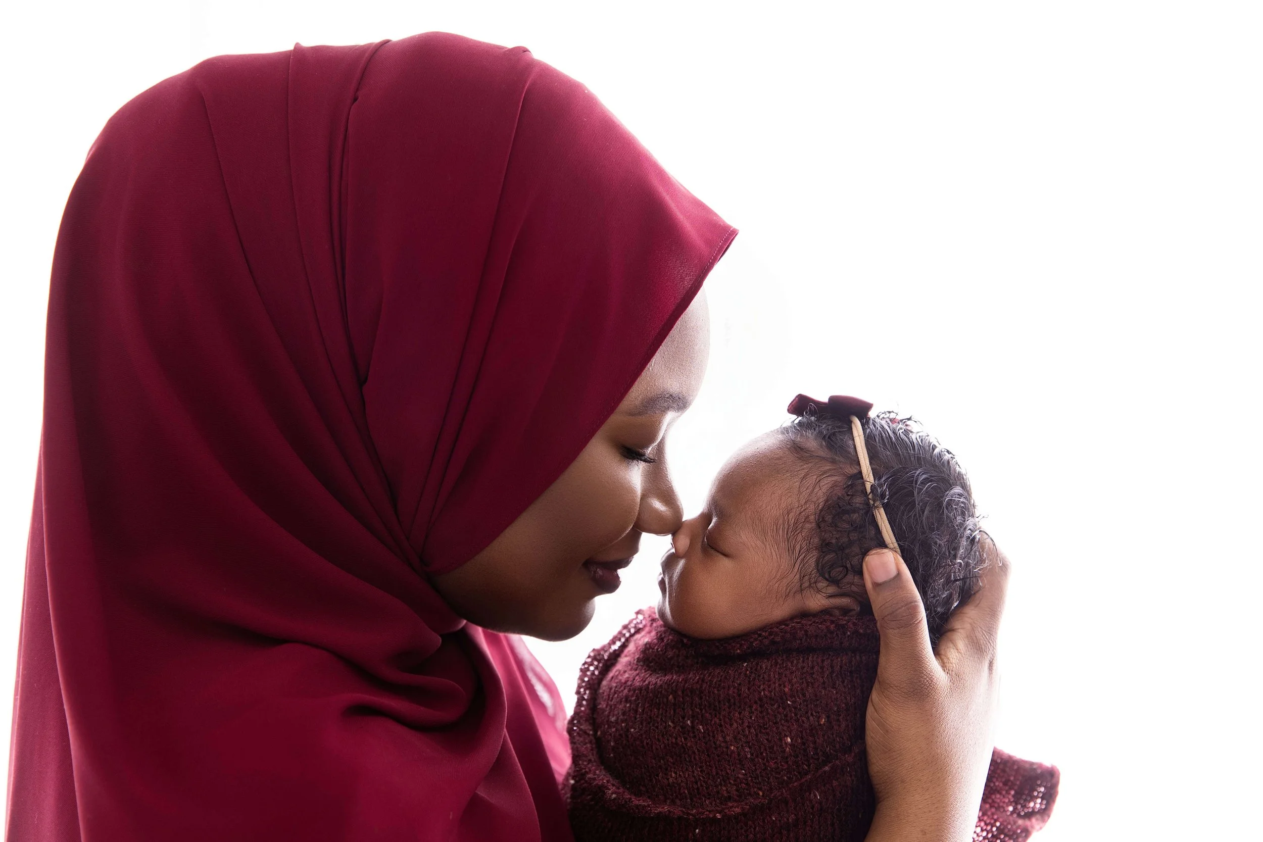 mom and baby touching noses