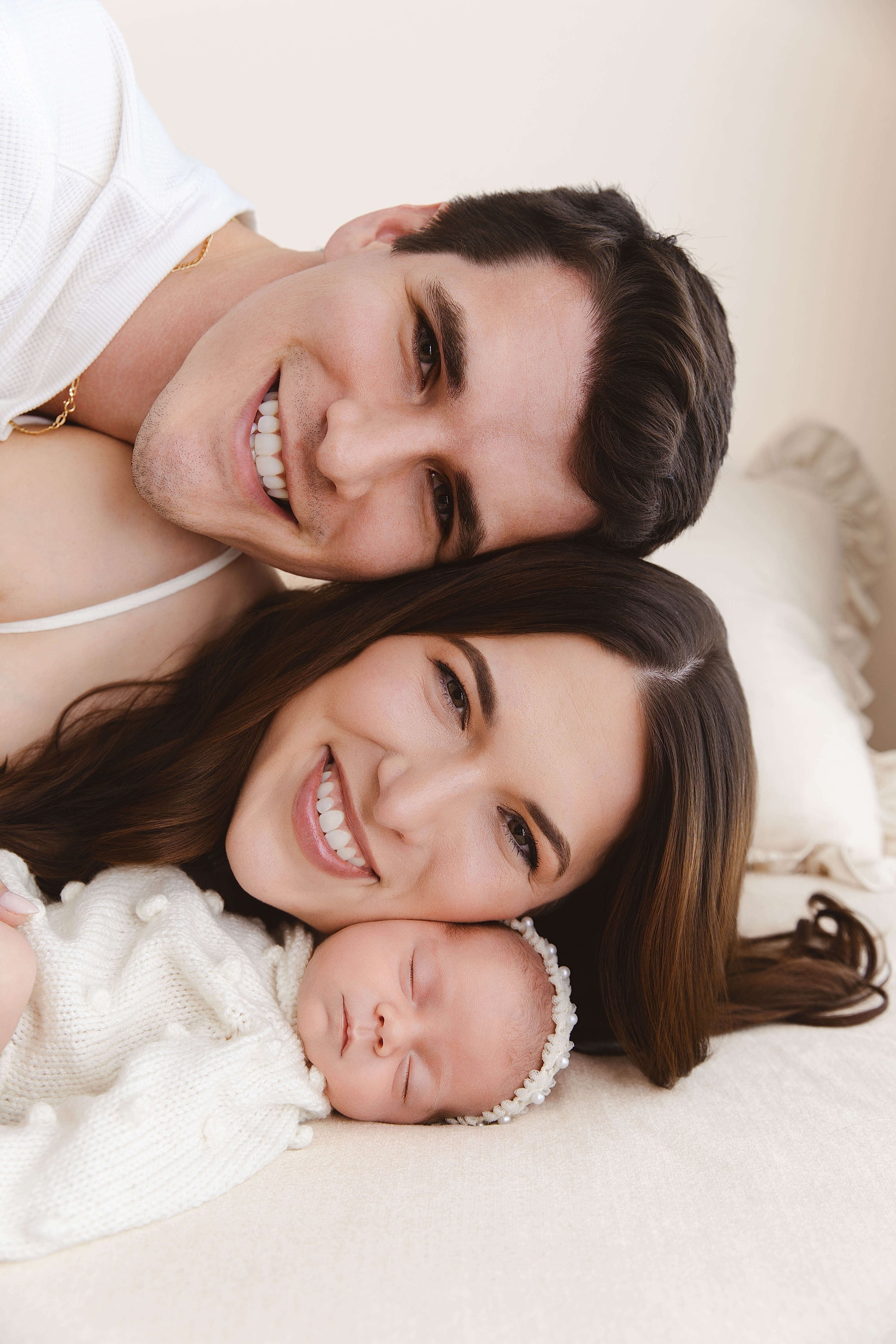 Sweet family photo of mother, father, and baby girl