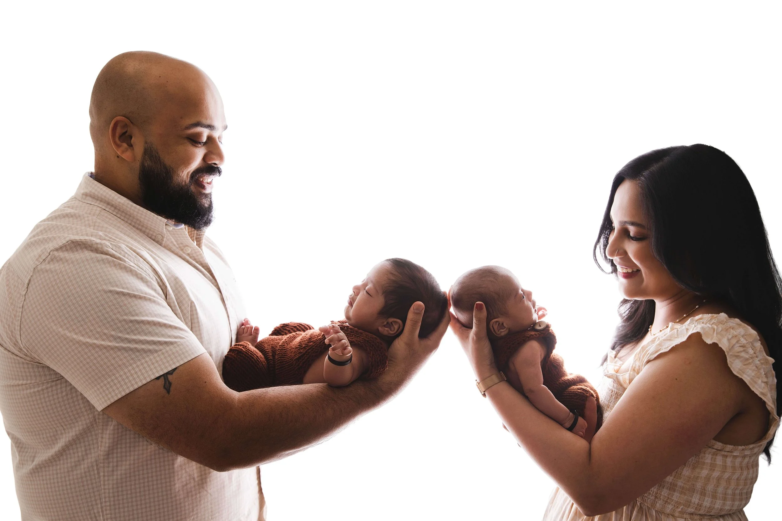 parents holding twins