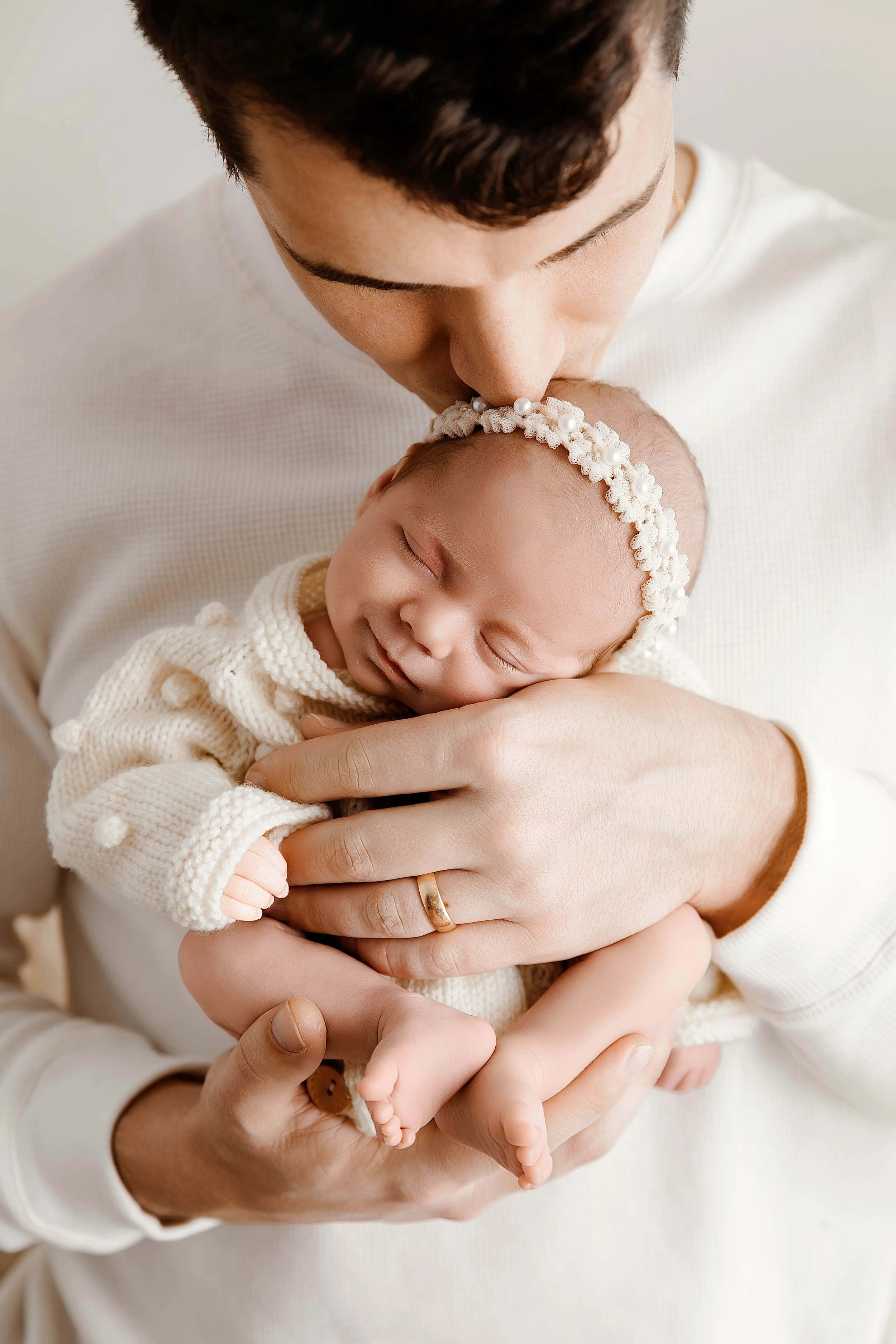 Dad holding his baby close