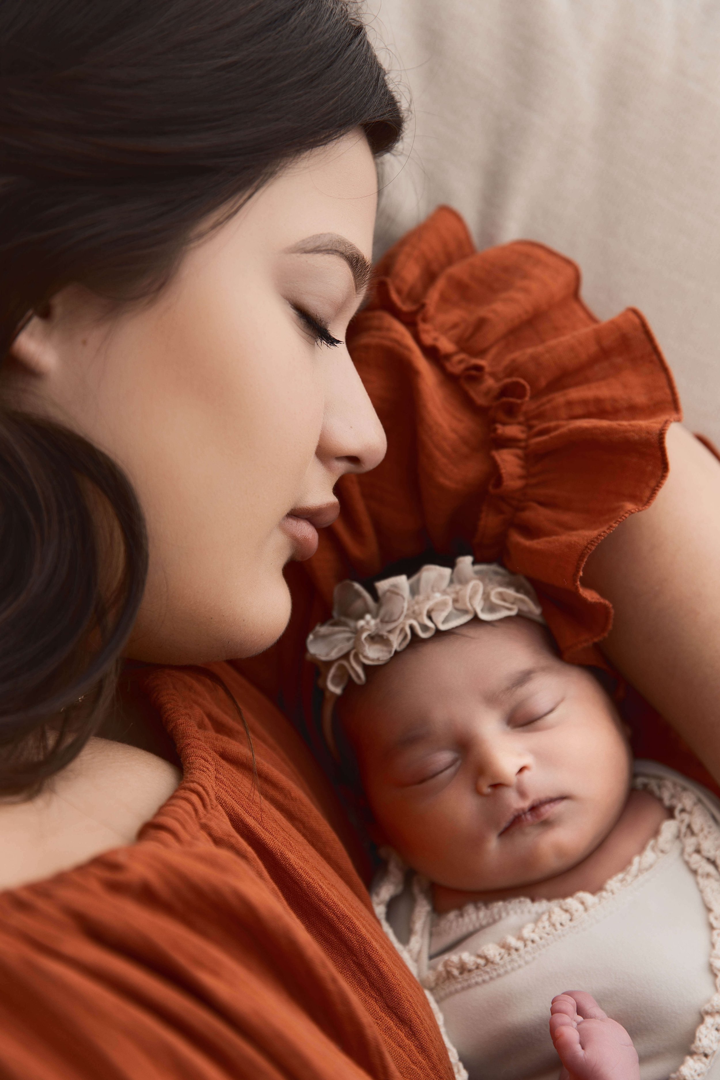 mom cuddling with newborn