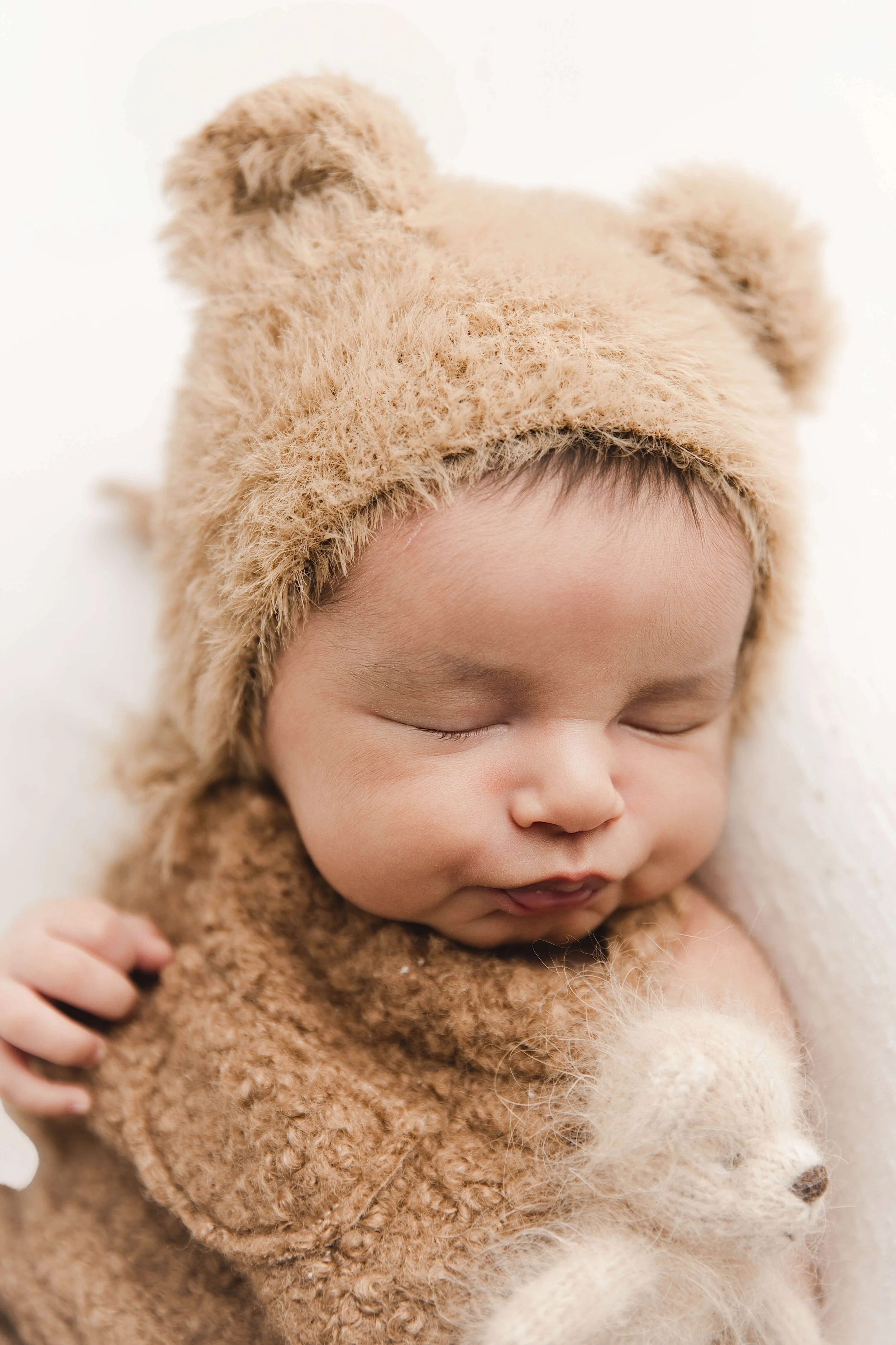 Fuzzy teddy bear hat on baby boy
