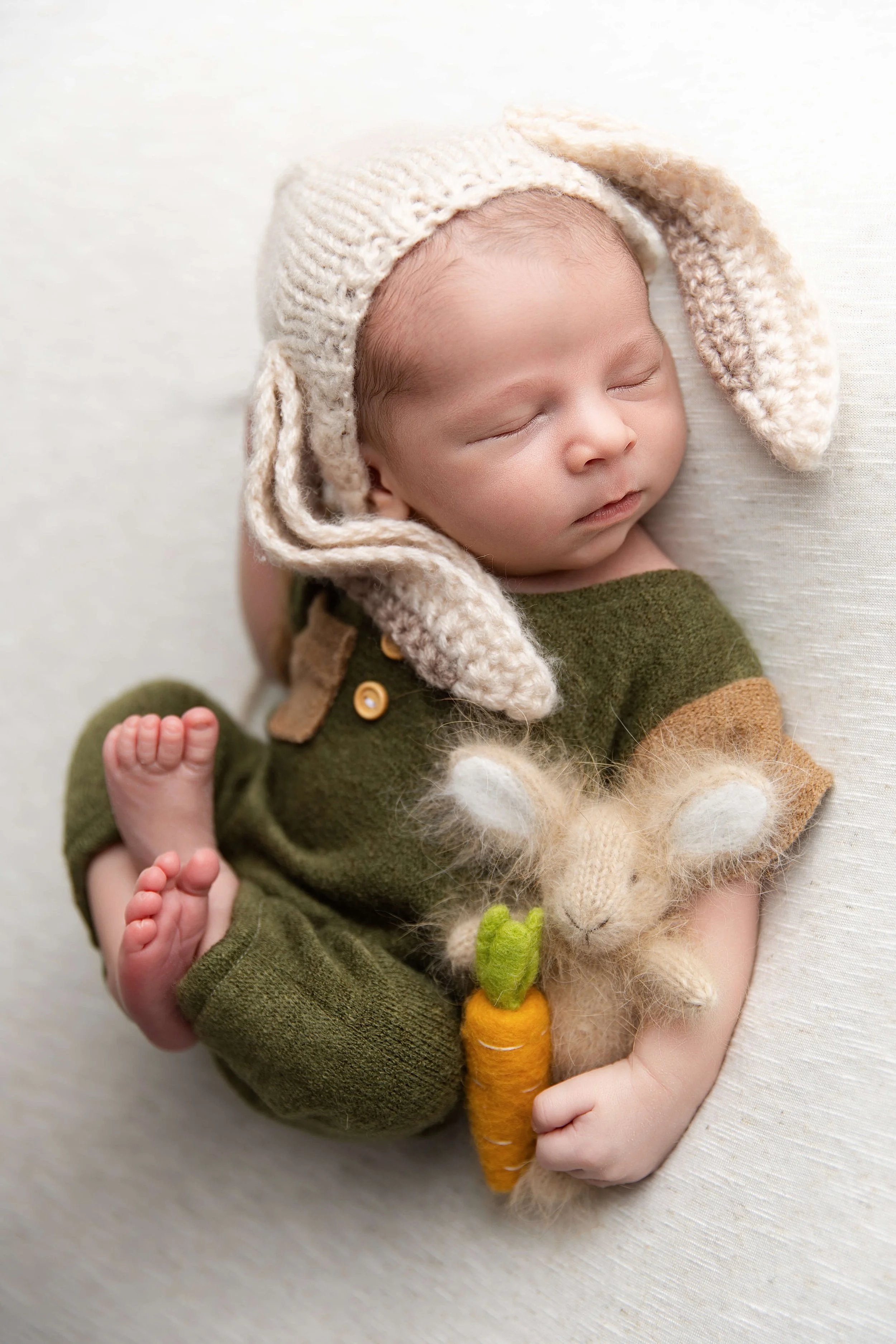 newborn baby in a bunny outfit