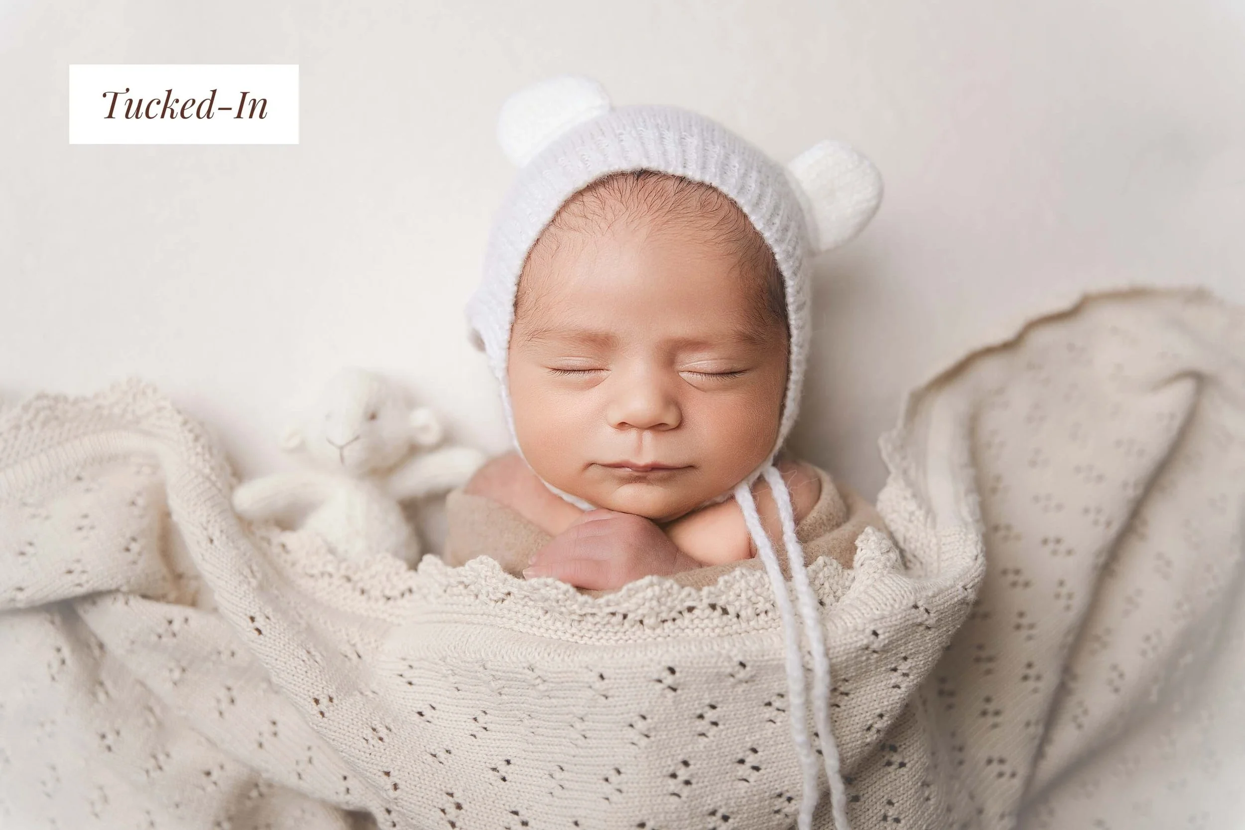 Baby wrapped in neutrals 