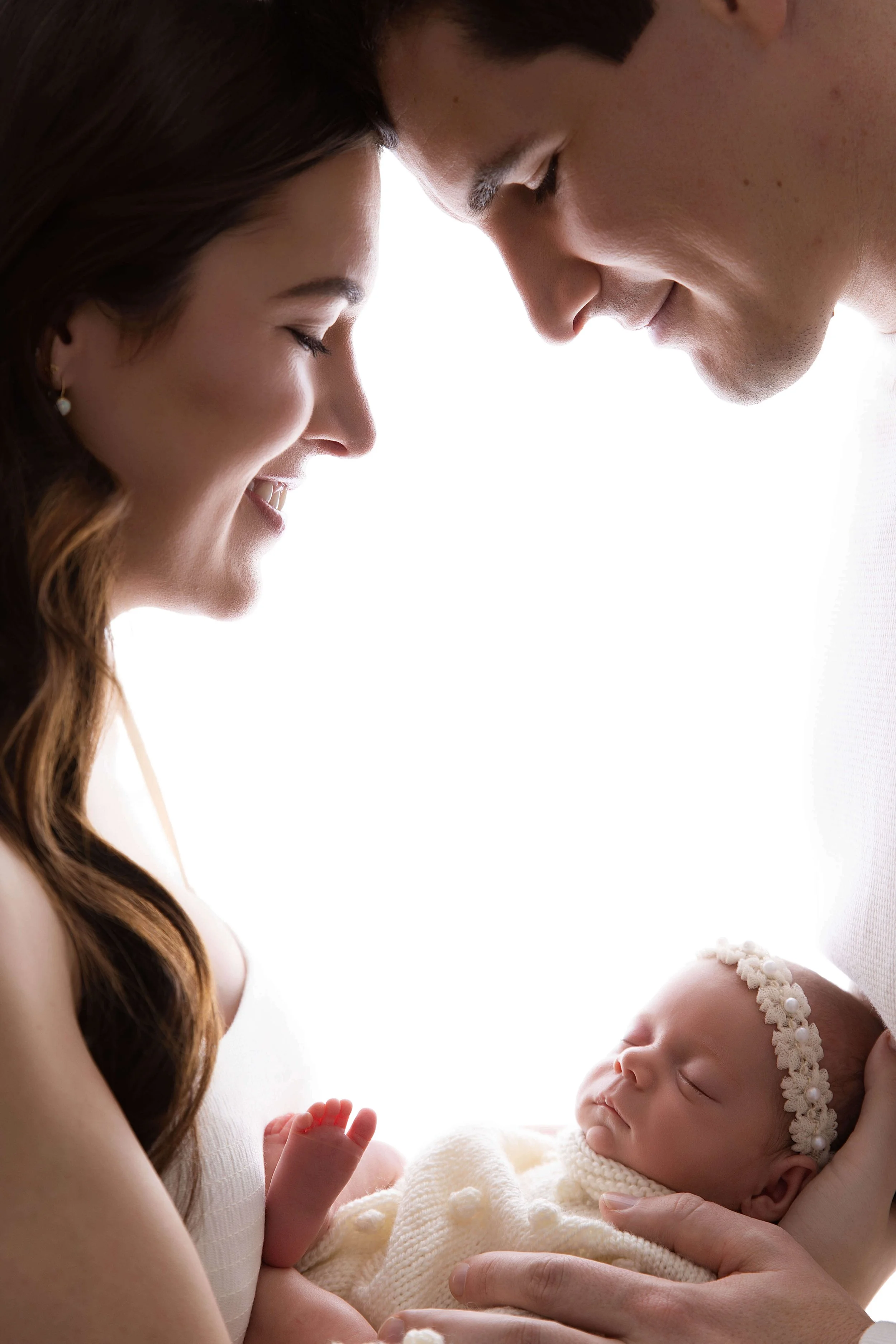 Parents looking down at their little one