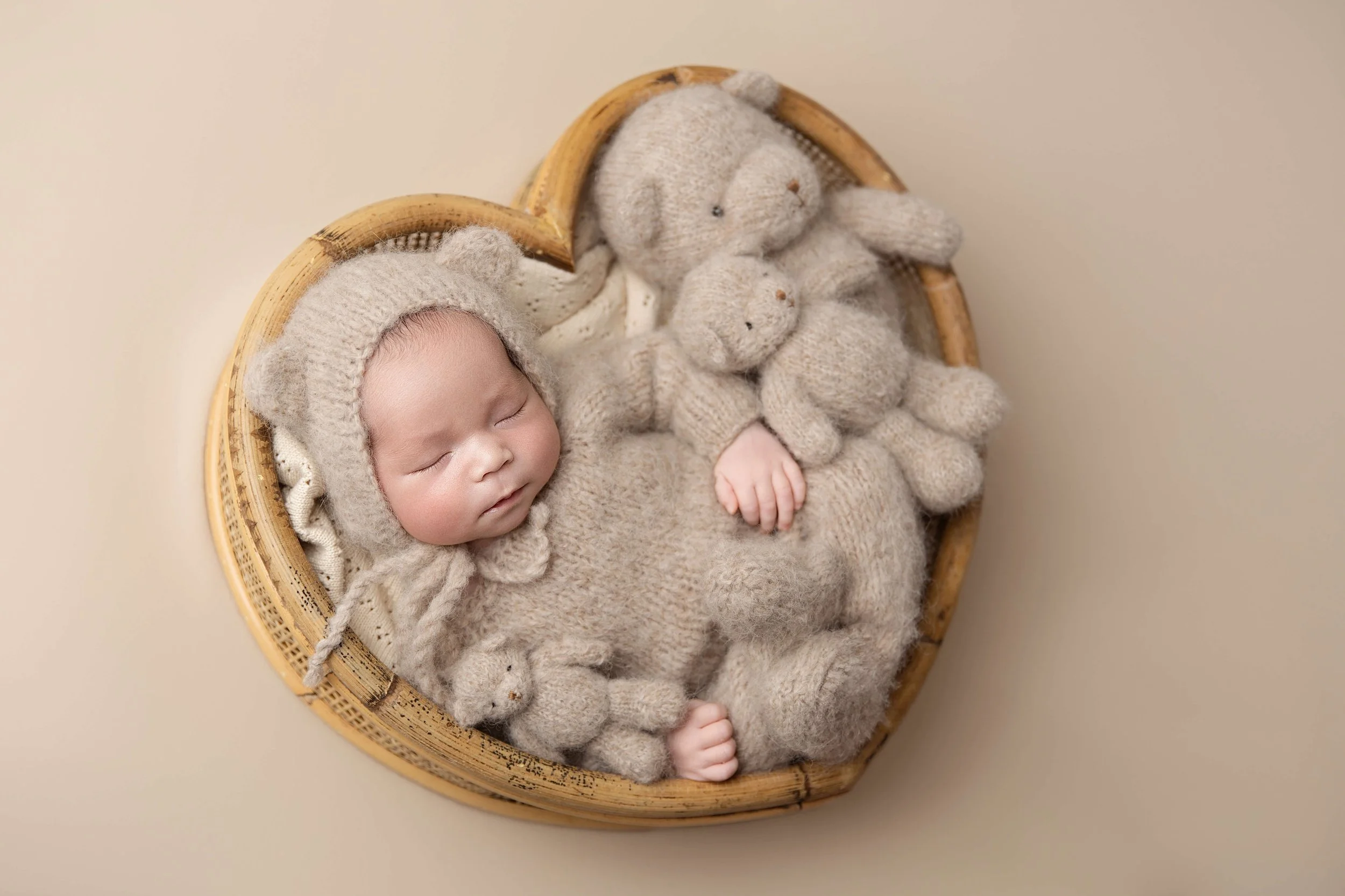newborn baby sleeping in a heart