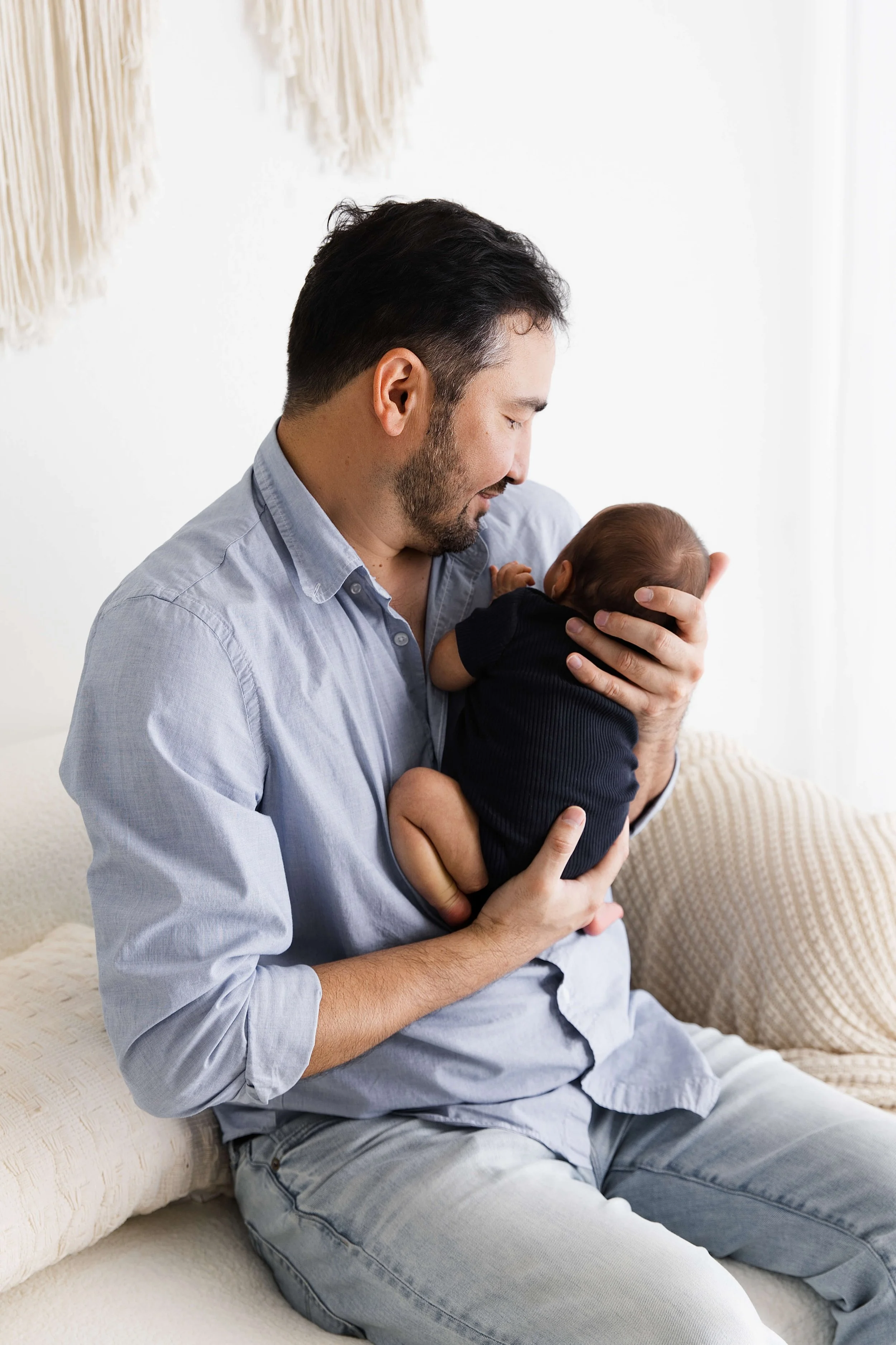 dad holding baby close