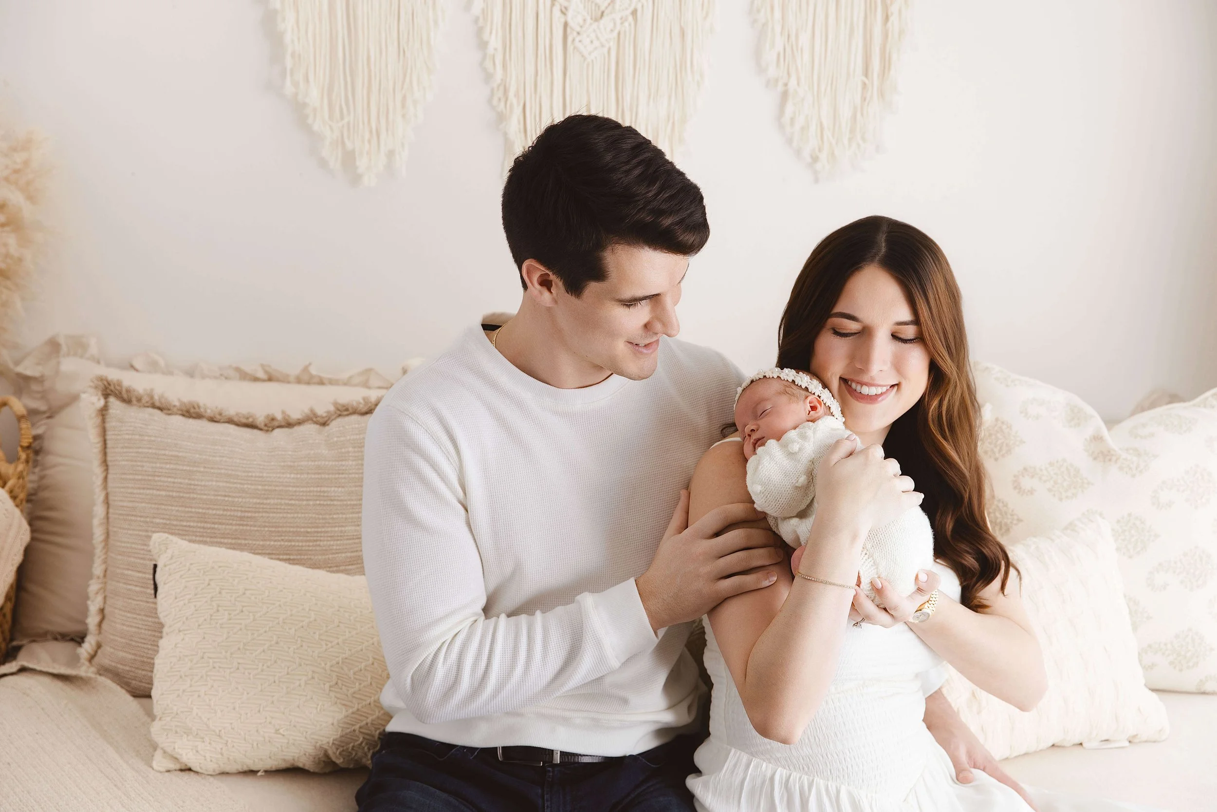 Studio photo of family with newborn