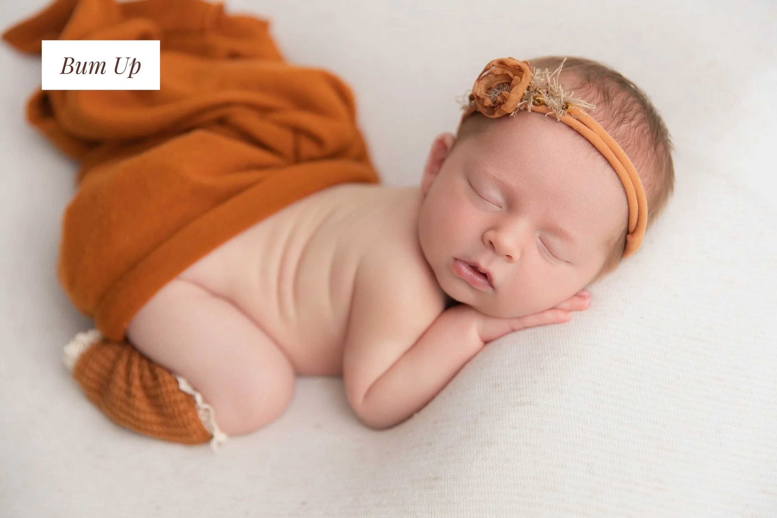 Baby girl in soft lighting in a studio