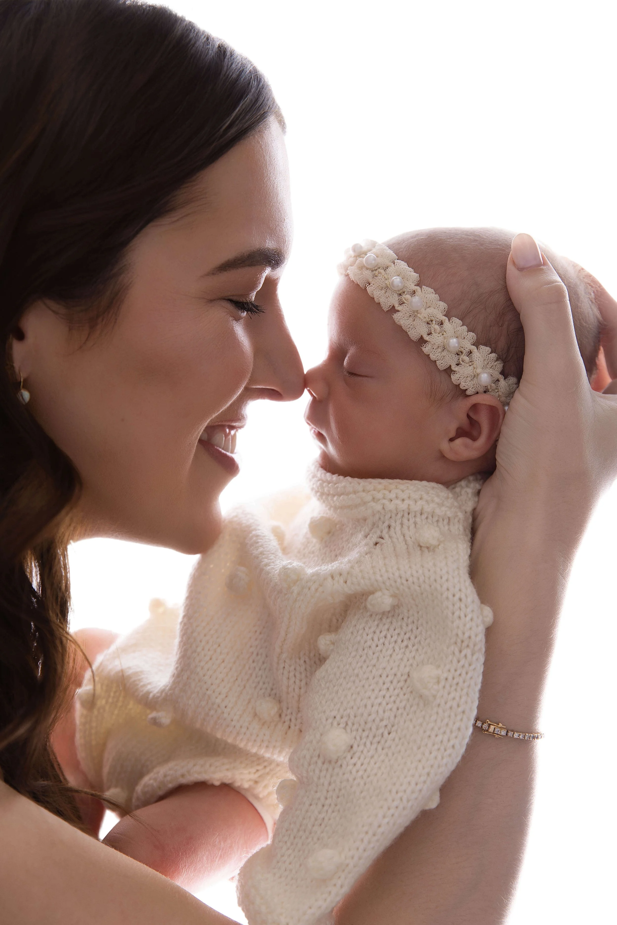 Mother holding her baby close