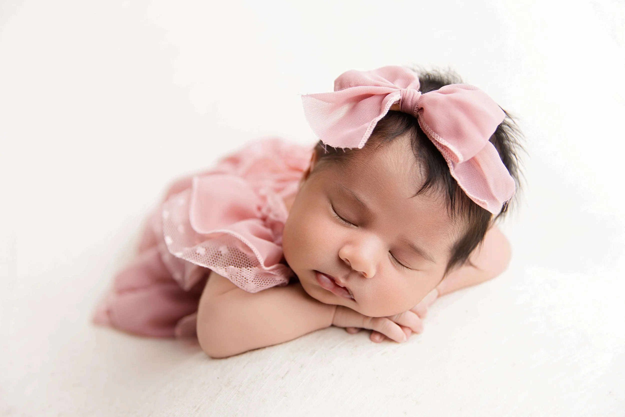 baby girl in the chin-on-hands pose