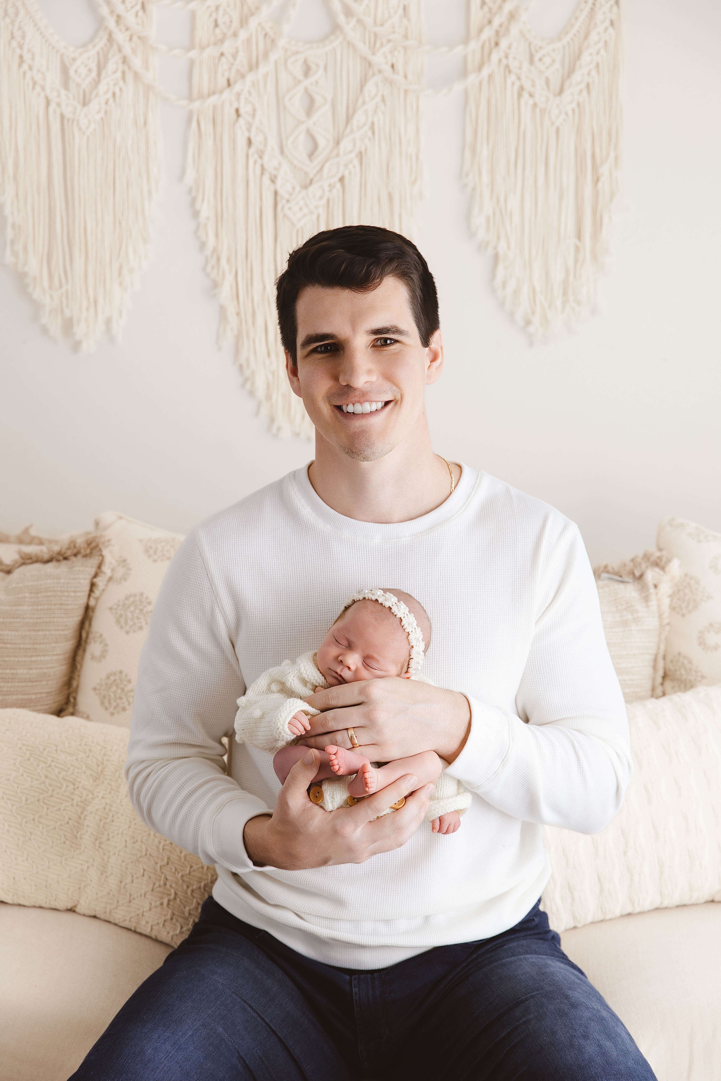 Father holding his newborn baby girl 