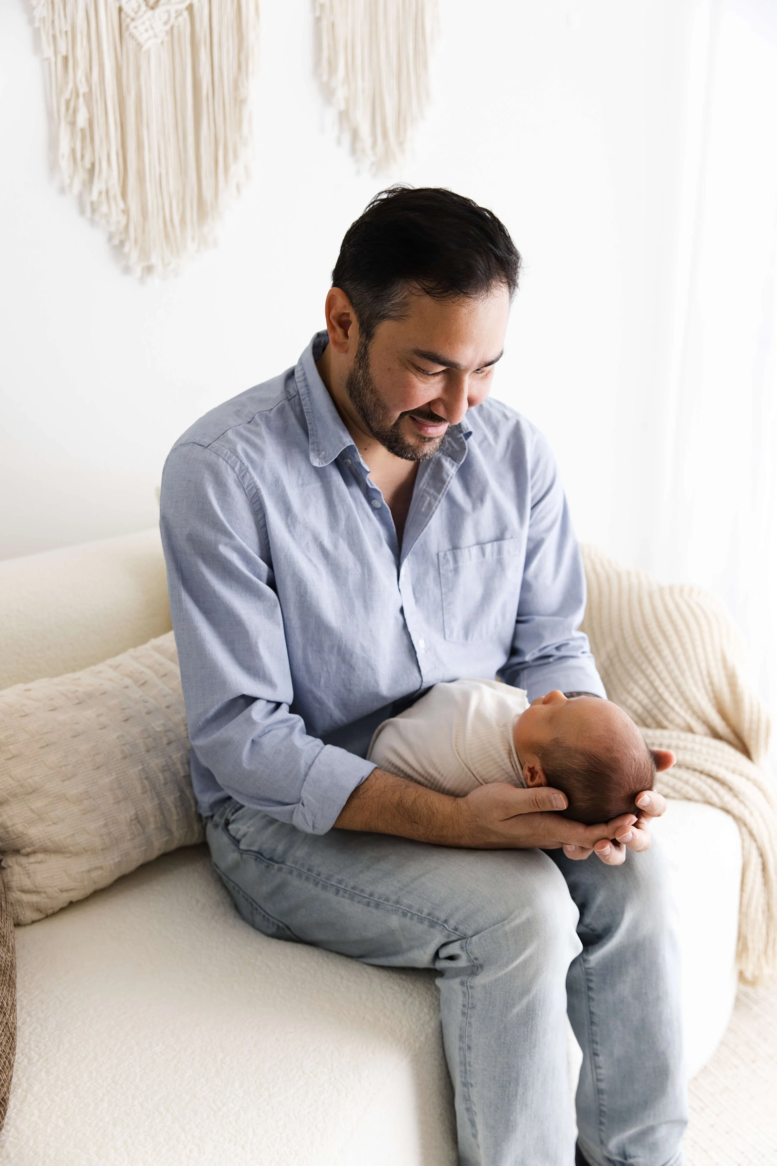 dad looking down at baby boy