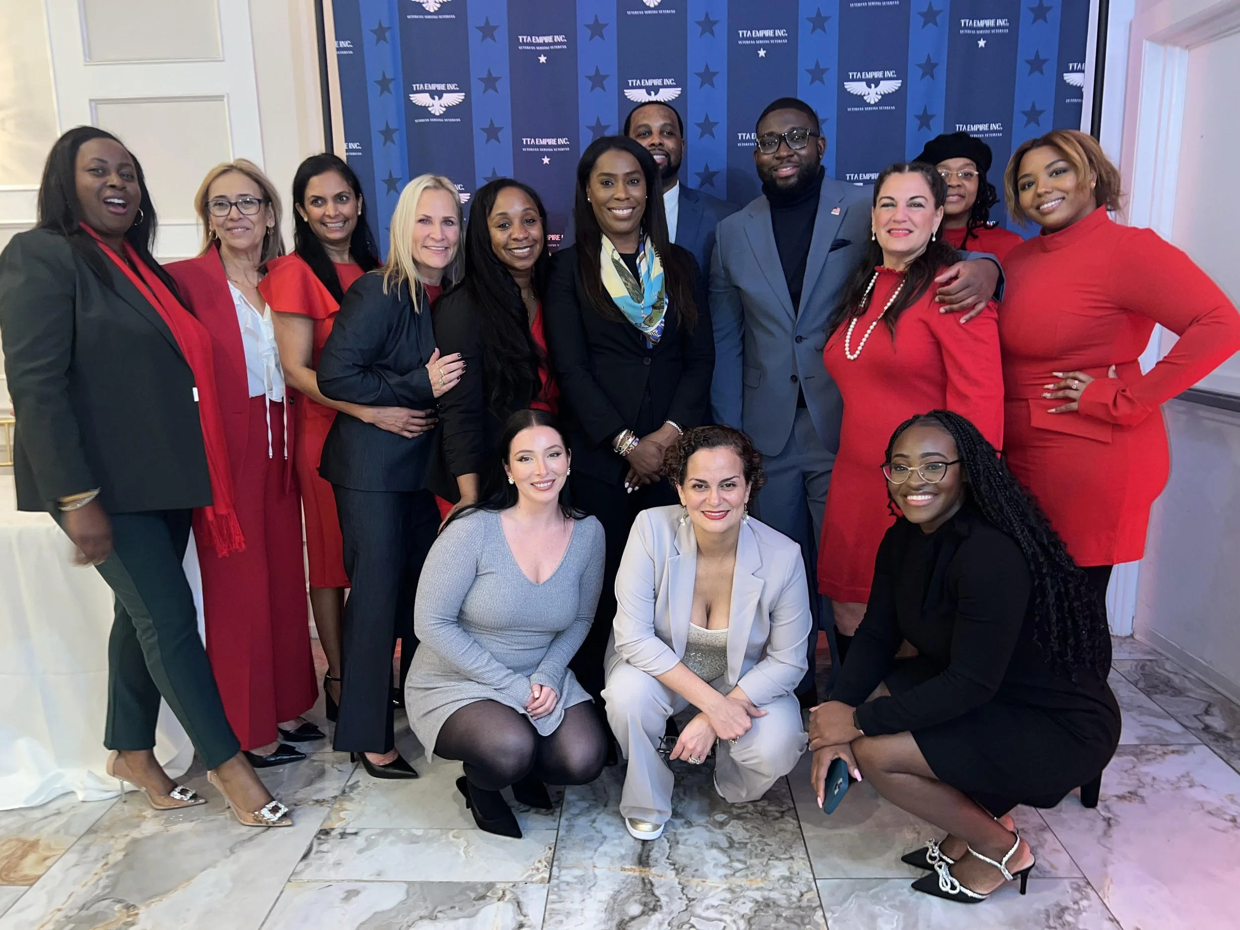 TTA Empire board posing for a photo at the one year anniversary event