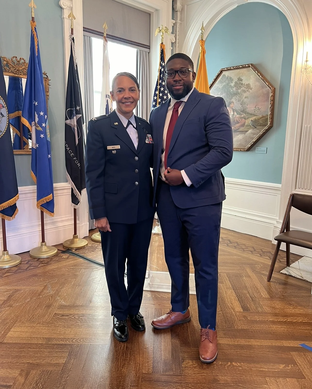 Timothy posing with a female veteran