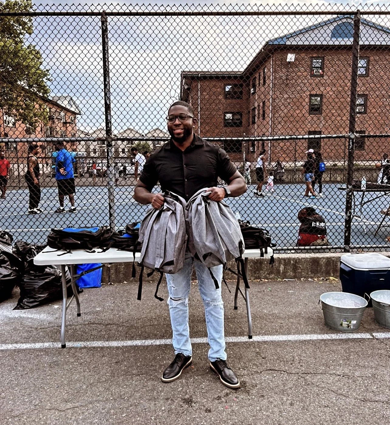 Timothy with backpacks for donations to veterans