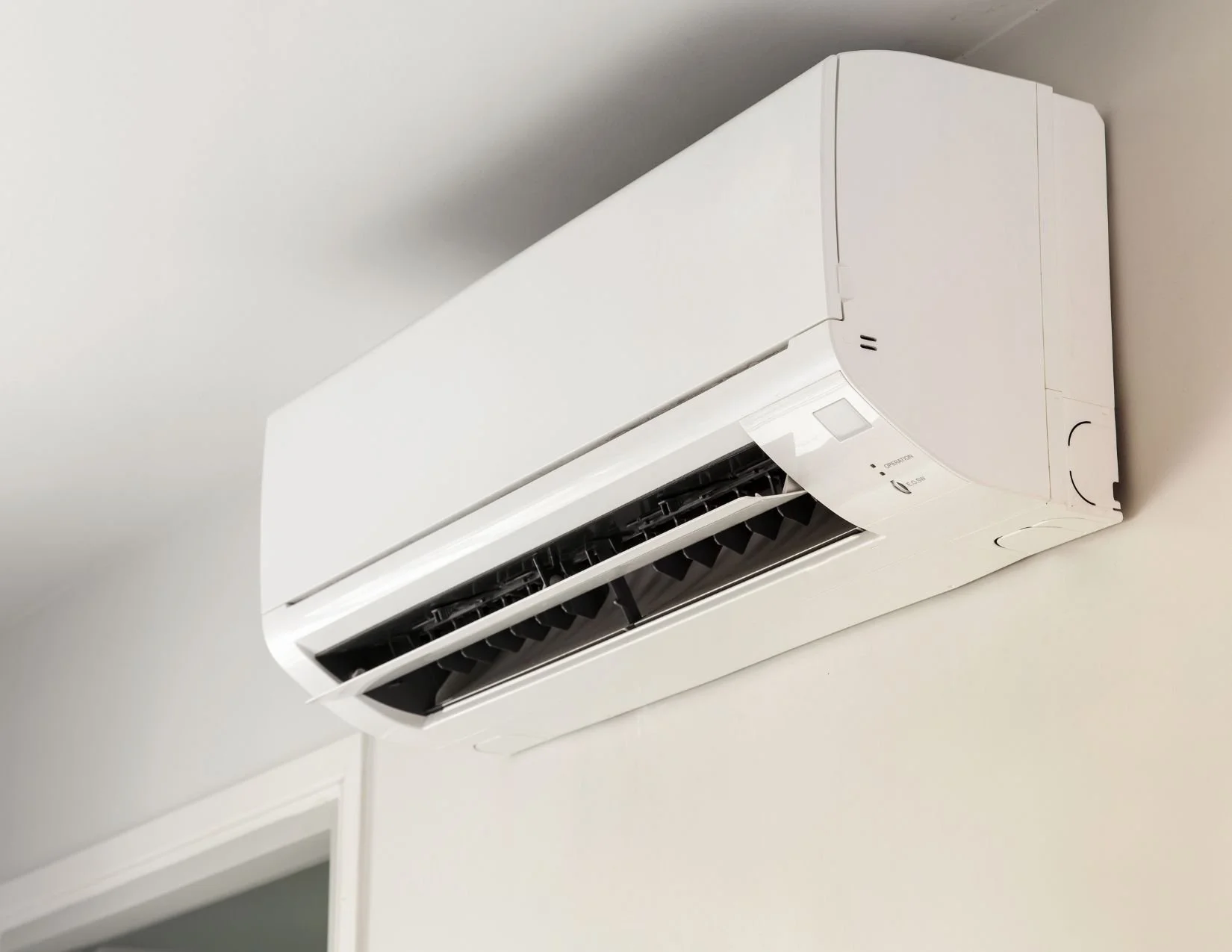 An Edmonton Air Conditioner that is mounted on the wall and has been making funny noises and is in need of professional HVAC repair