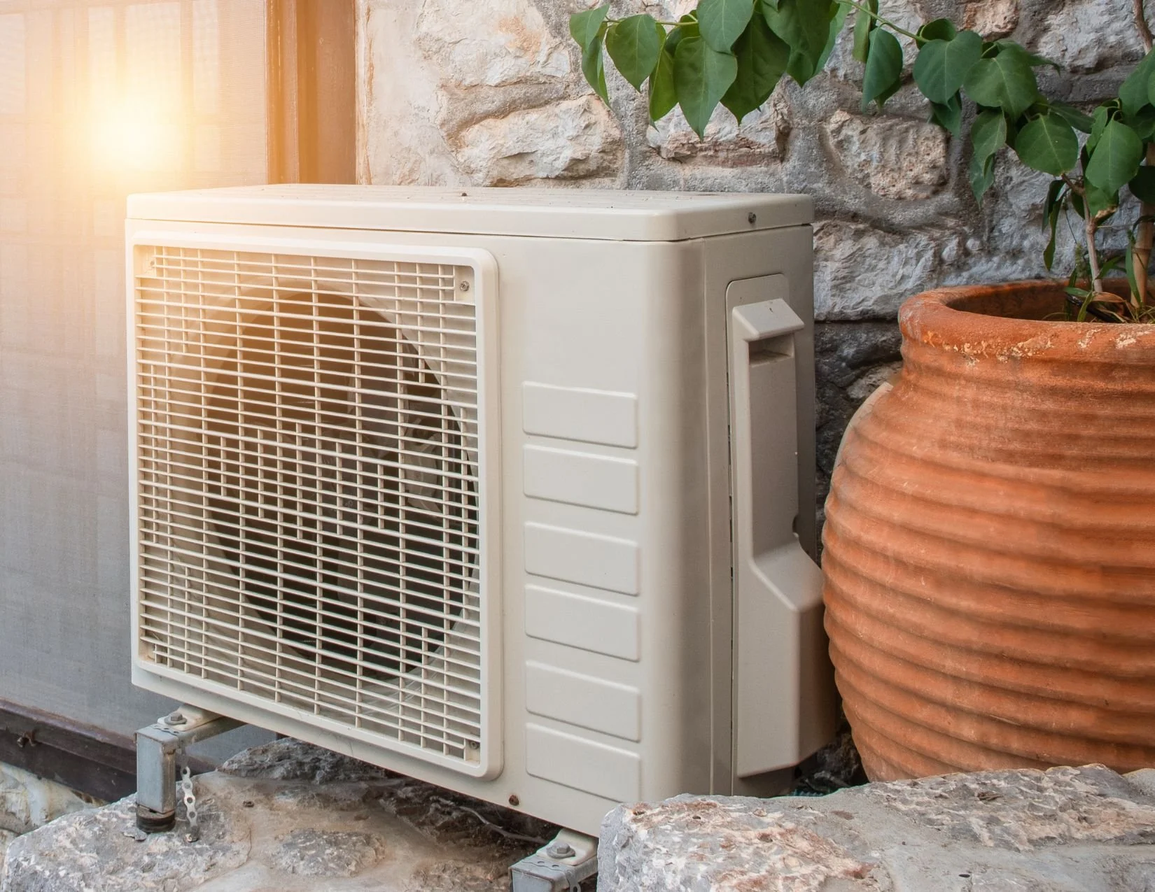An outdoor heat pump unit in Edmonton in need of cleaning and heat pump repairs