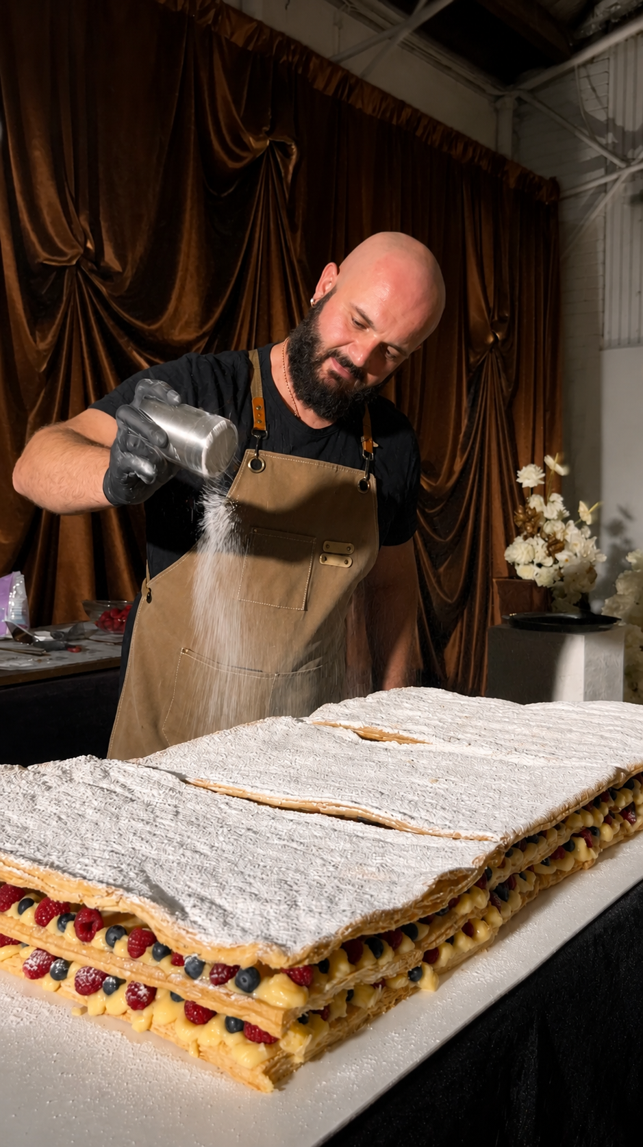 Chef dusting icing sugar over live Millefoglie dessert experience, Italian Perthy Perth