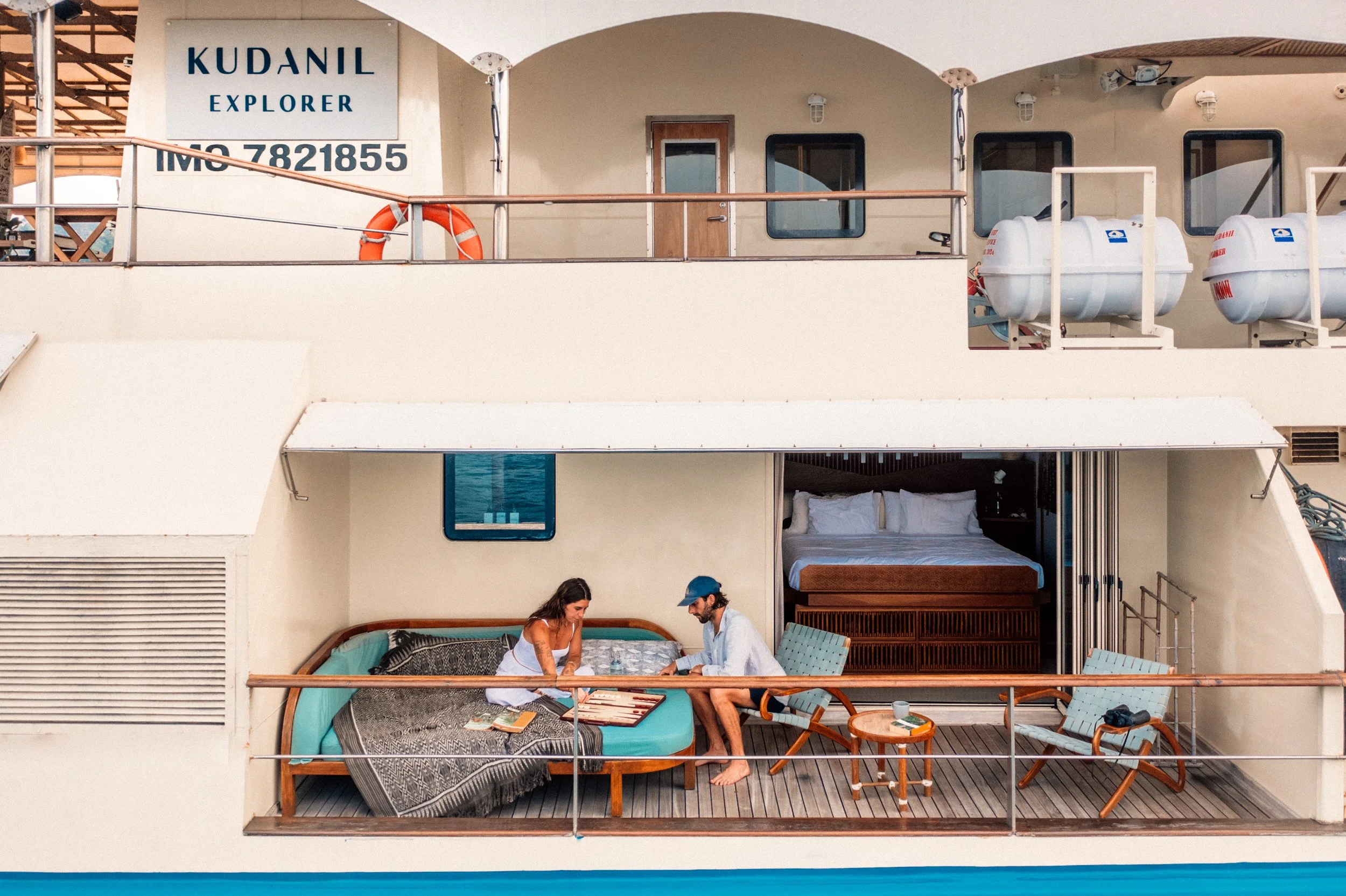 Guests enjoying a luxury surf trip in Indonesia aboard the Kudanil Explorer
