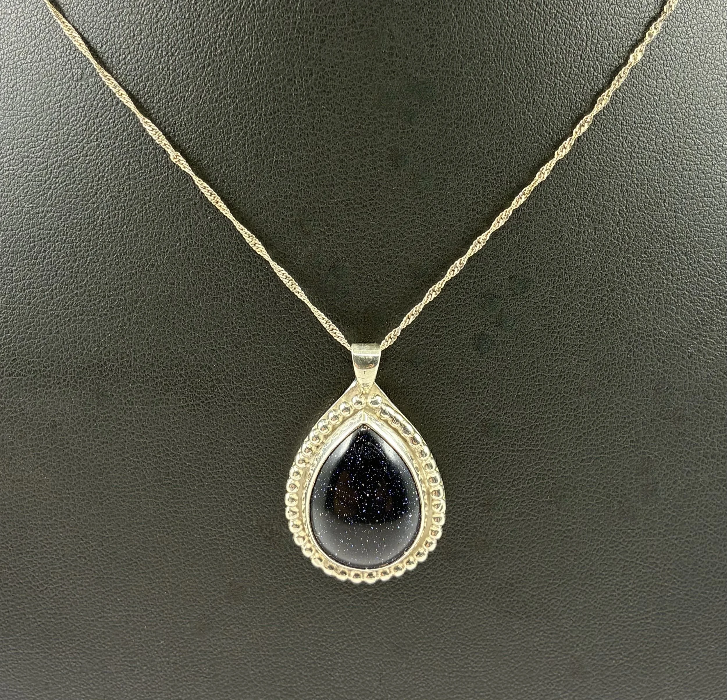 (20)  Sterling Silver and Gold Stone Pendant