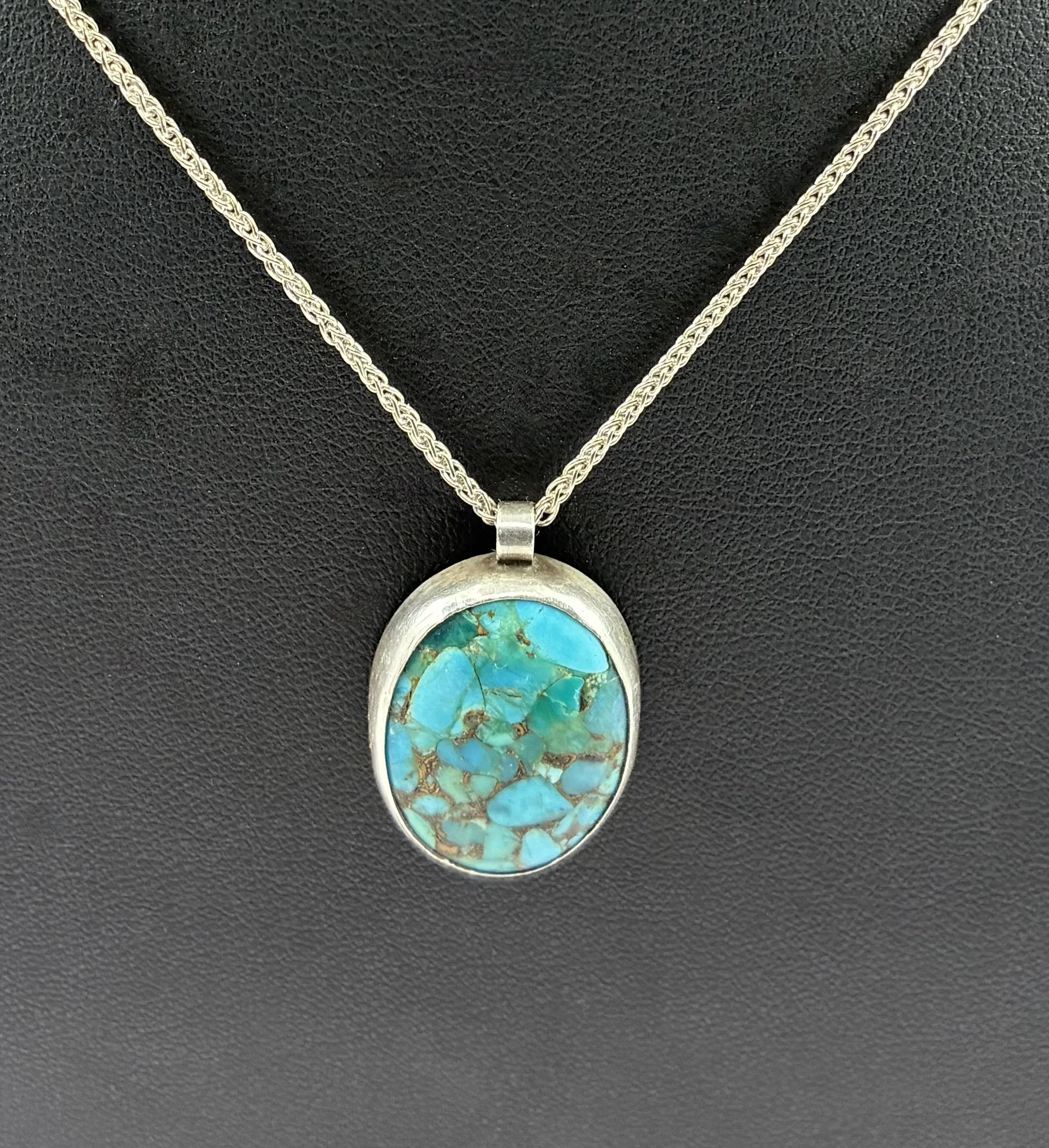 (27) Sterling Silver and Matrix Turquoise Pendant