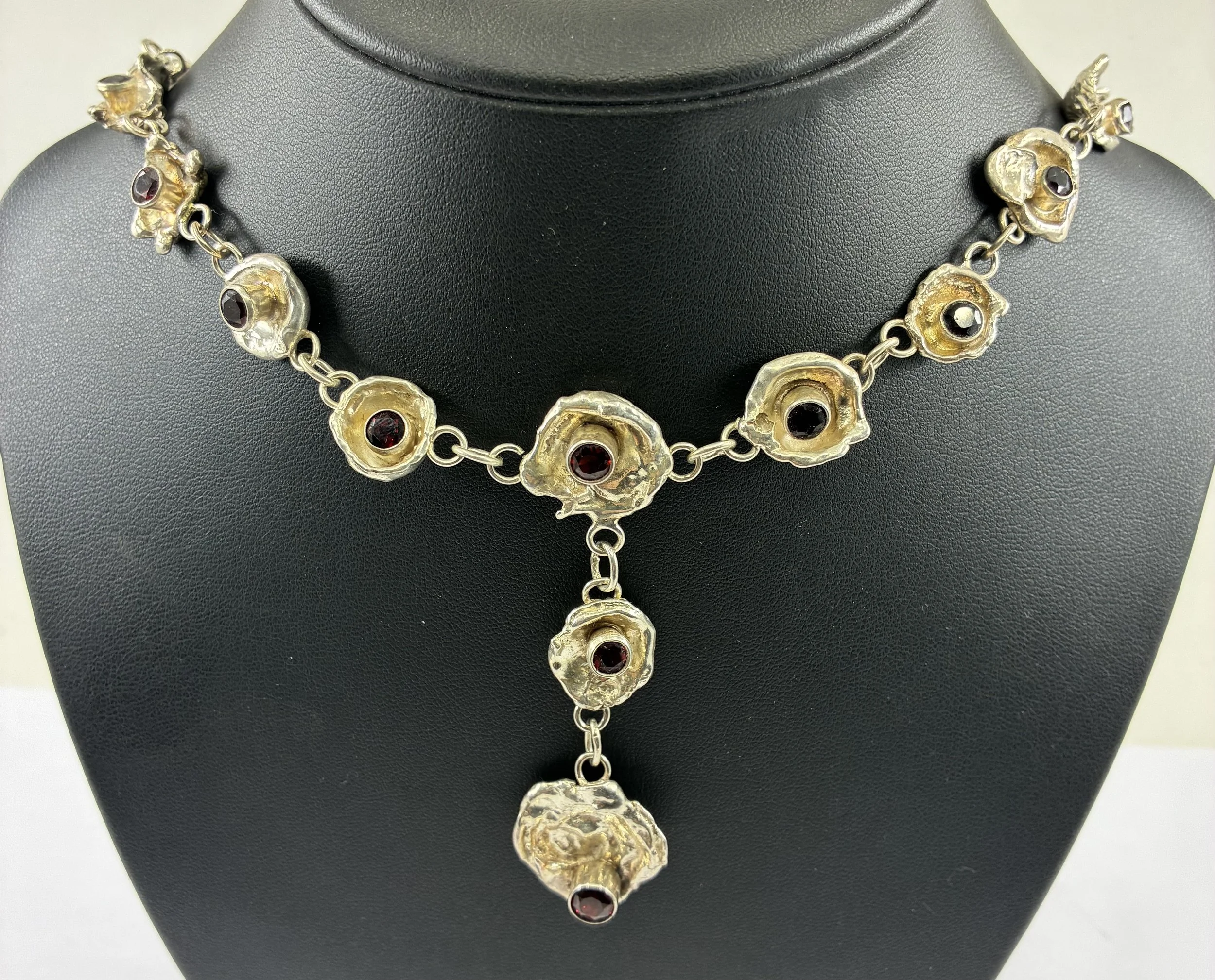 (39) Sterling Silver Water Cast and Garnet Neckless