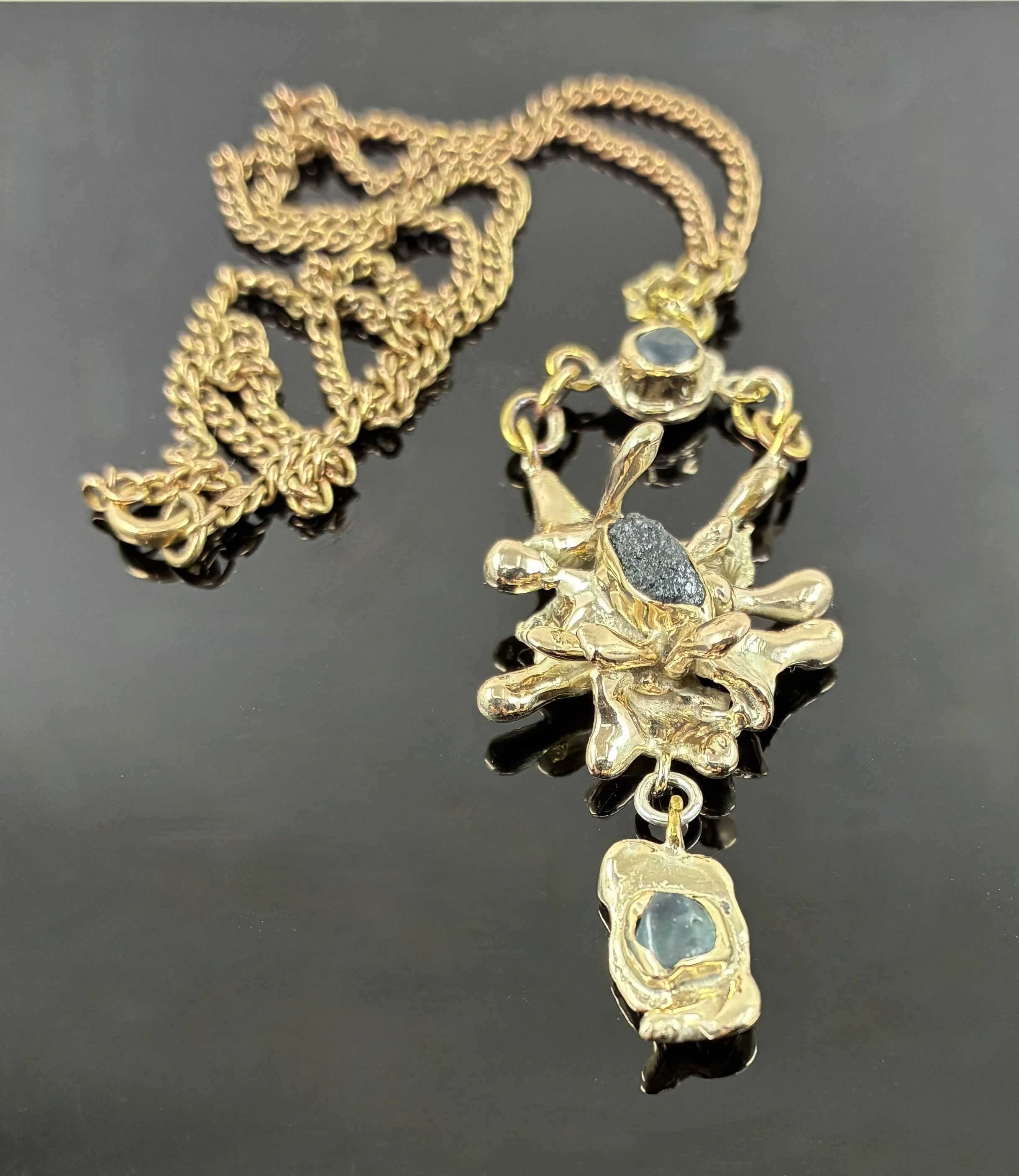 (52) 9ct Gold Water Cast and Raw Sapphire Pendant