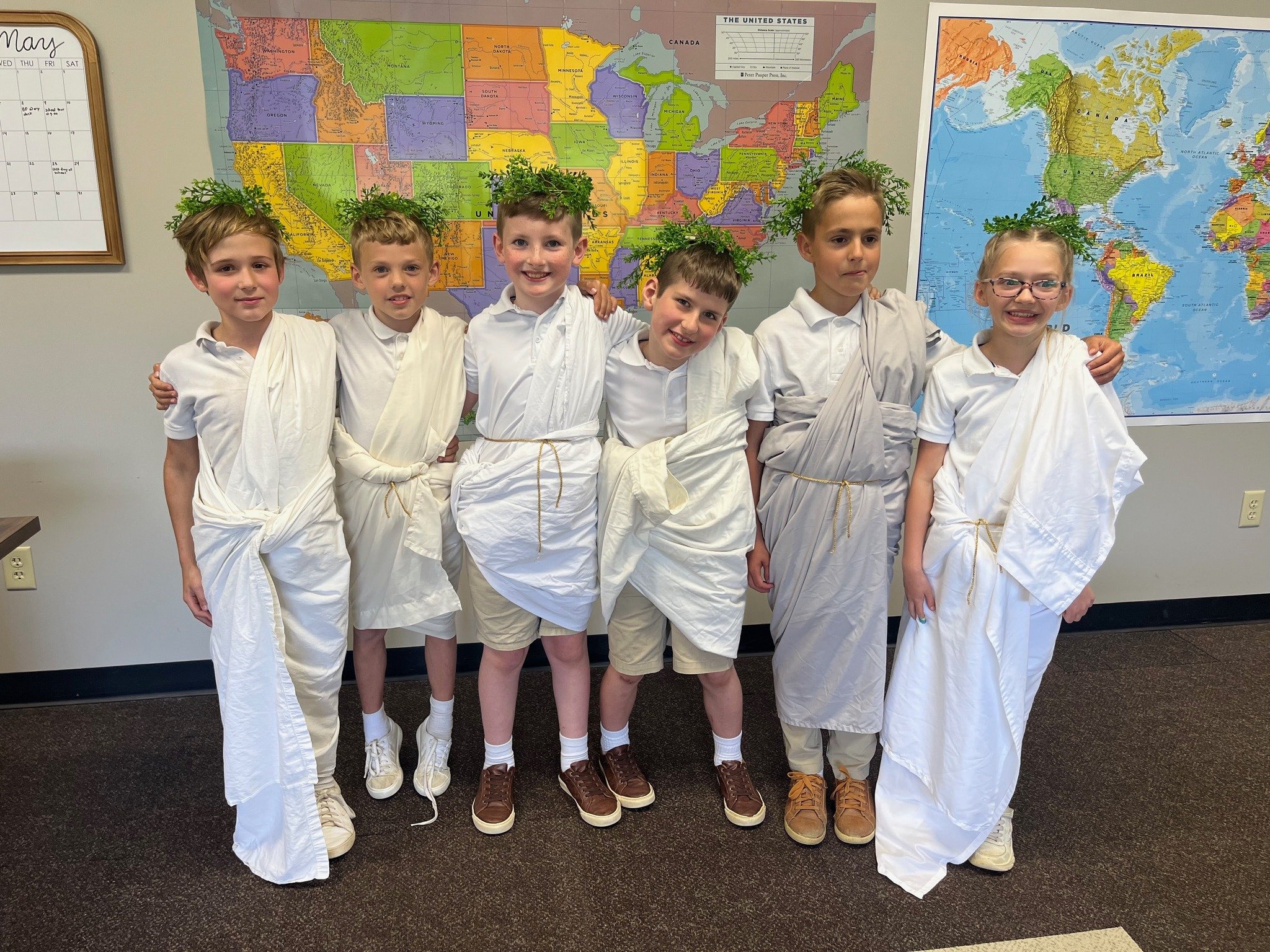 Veni, Vidi, Edi: I came, I saw, I ate?
Our Second and Third Grade class celebrated their semester long study of Greek and Roman History by dressing up like Roman senators and enjoying a traditional Mediterranean feast! 
Et tu, Bubus? (And you, Grapes