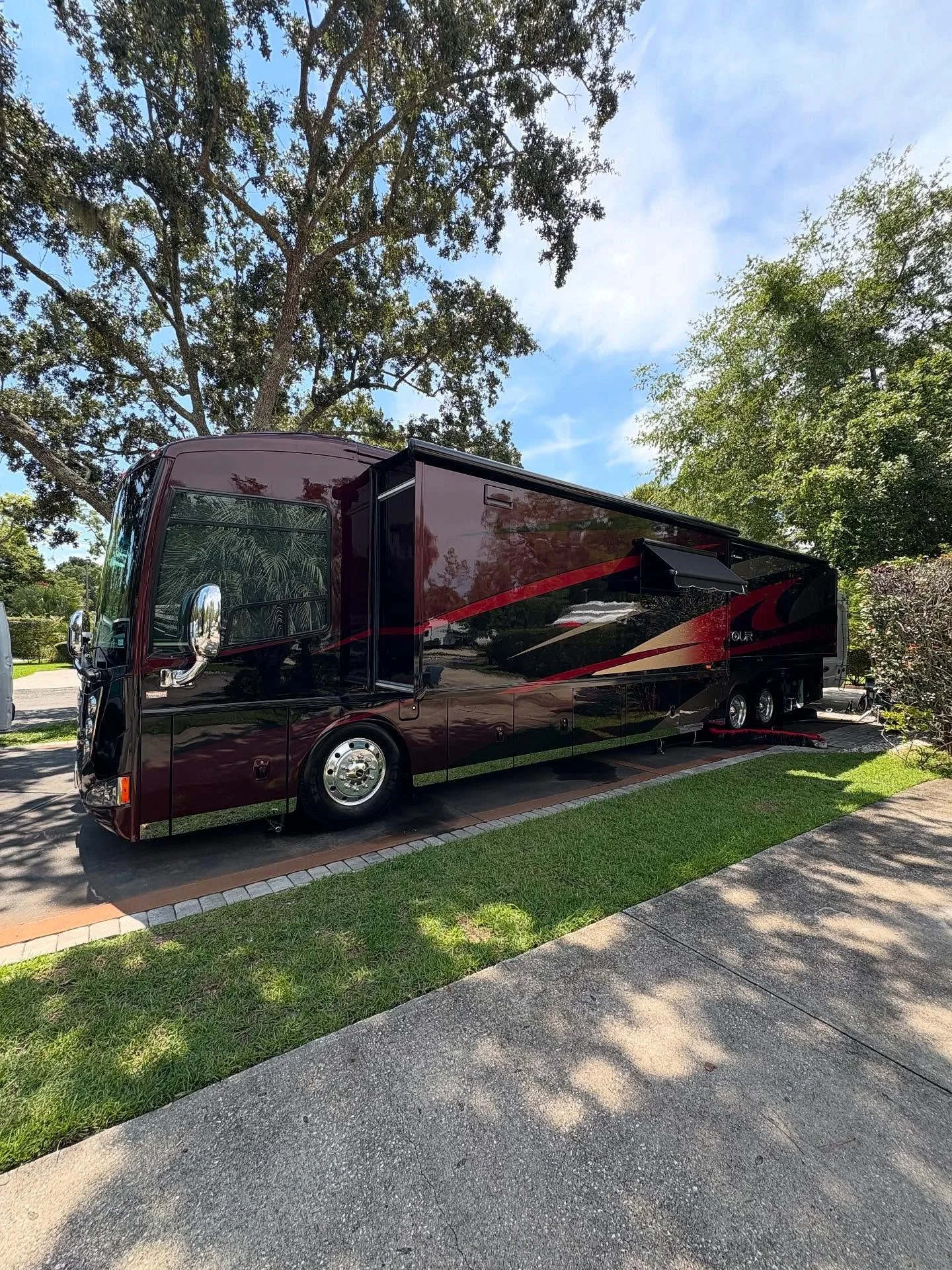 Big red shiny ceramic coated class a motor home