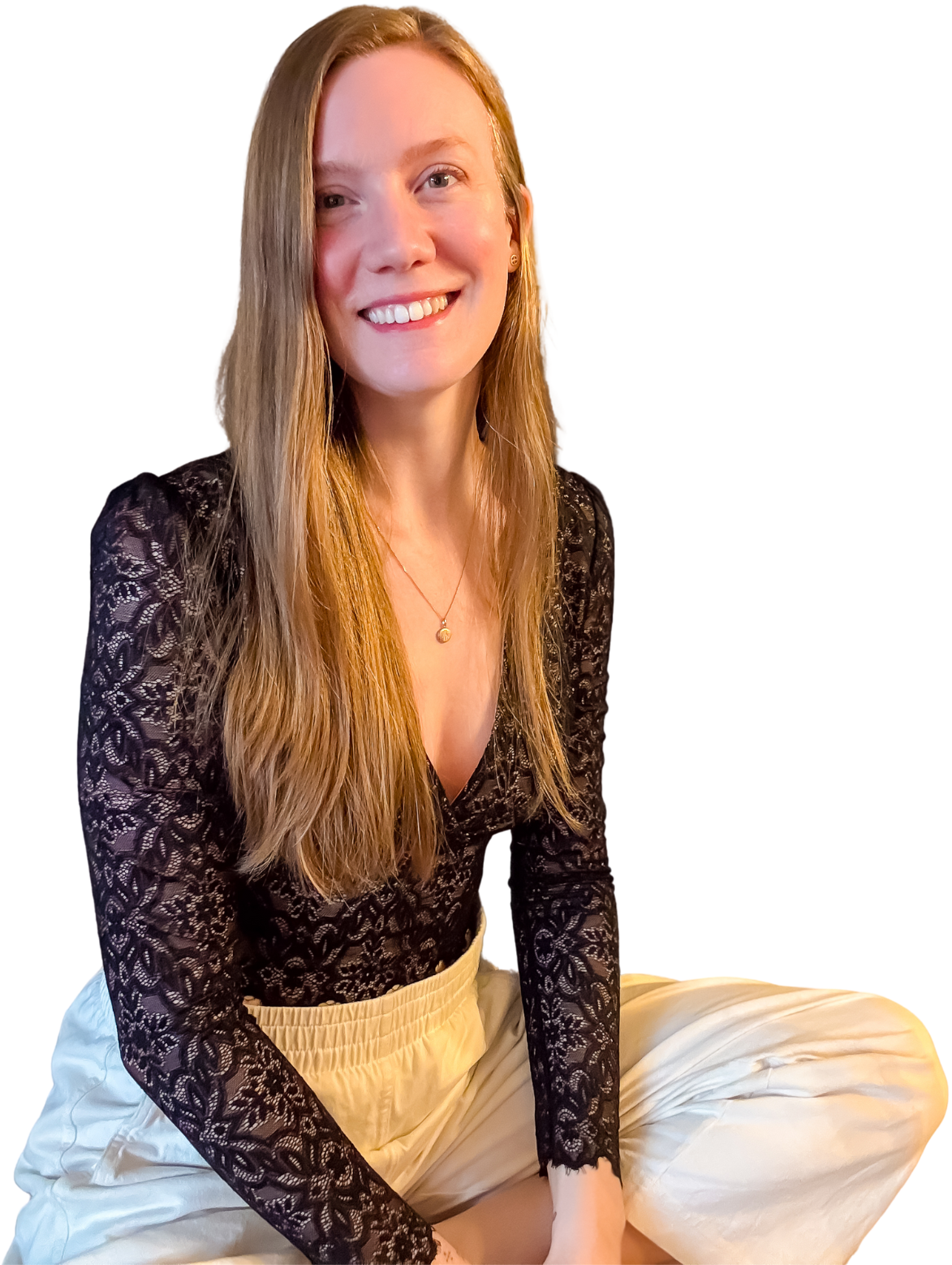 Picture of Virginia, legs crossed, and smiling