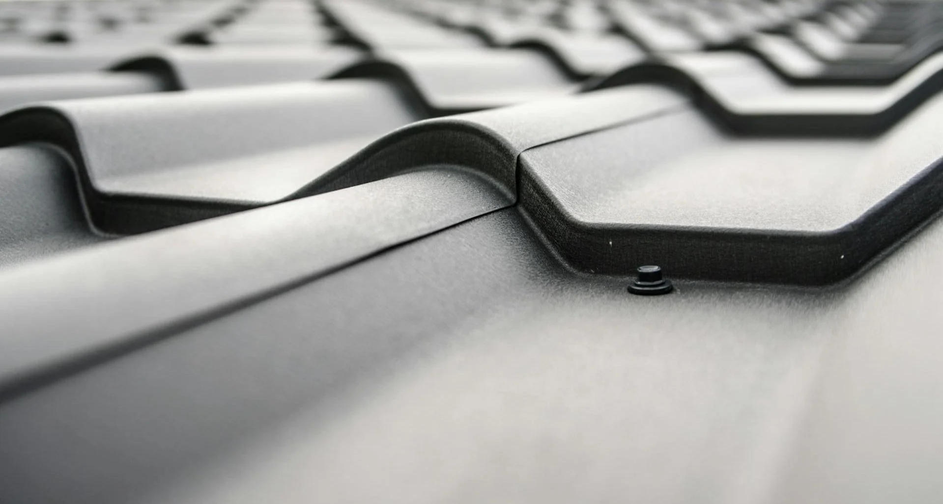 Close-up of metal roofing panels on a residential roof in Calgary, showing standing seam detail