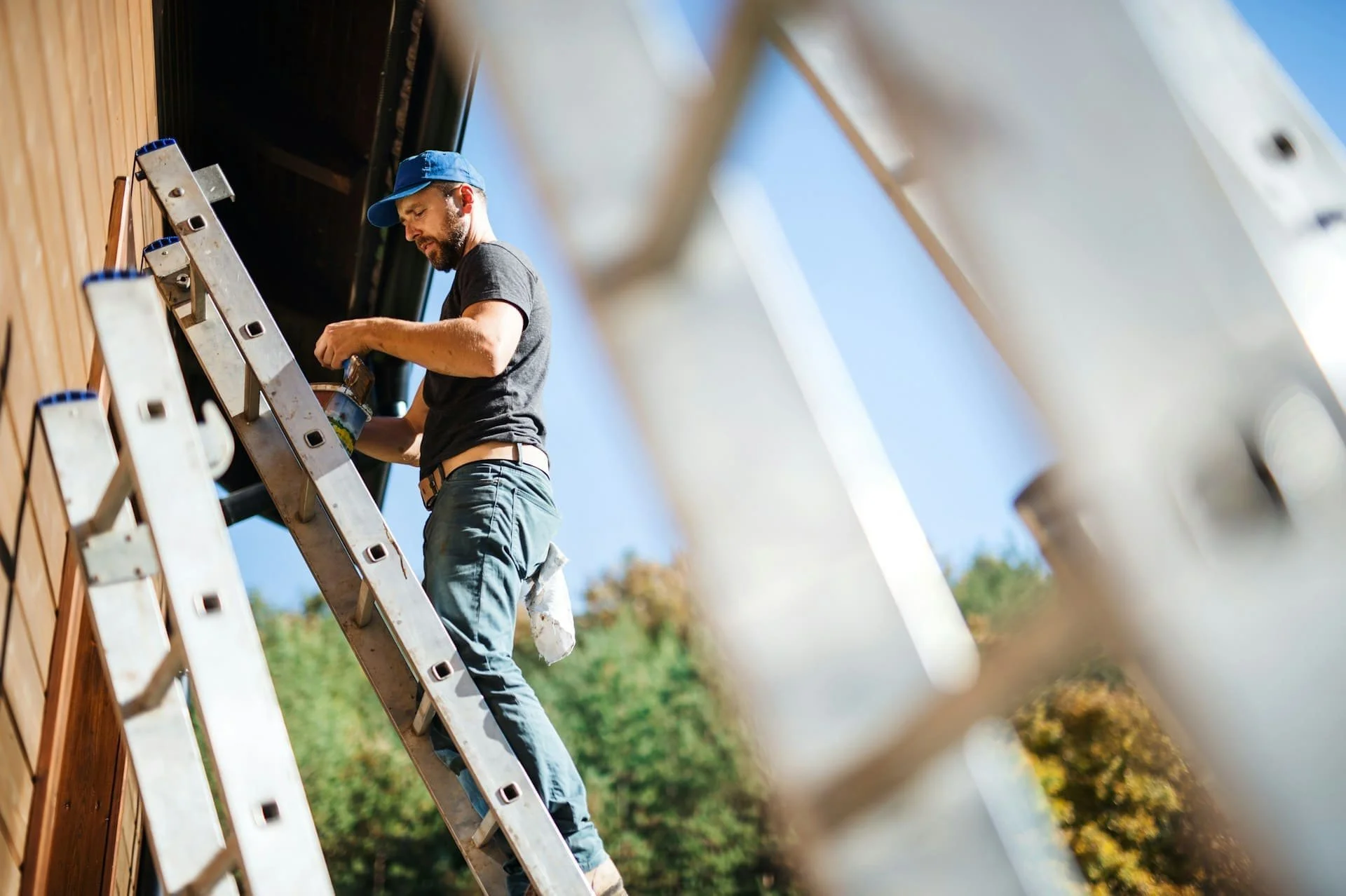 Roofing professional inspecting and working on a residential roof in Calgary during exterior roof inspection