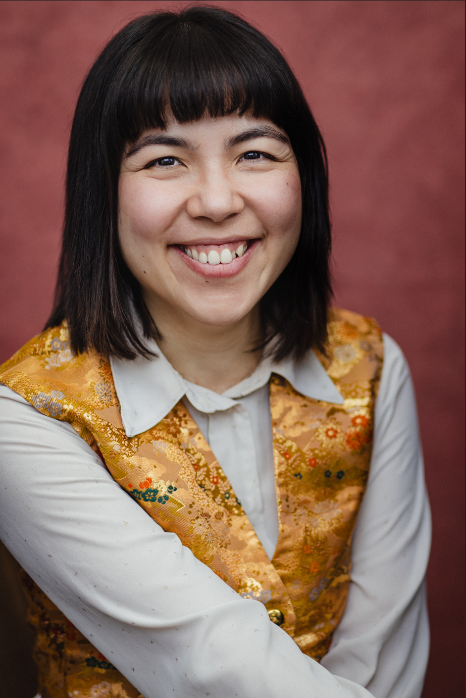 Headshot with Japanese fabric waistcoat and big smile by Joss Ryder