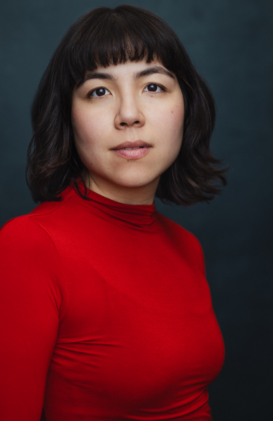 Headshot in red top by Joss Ryder