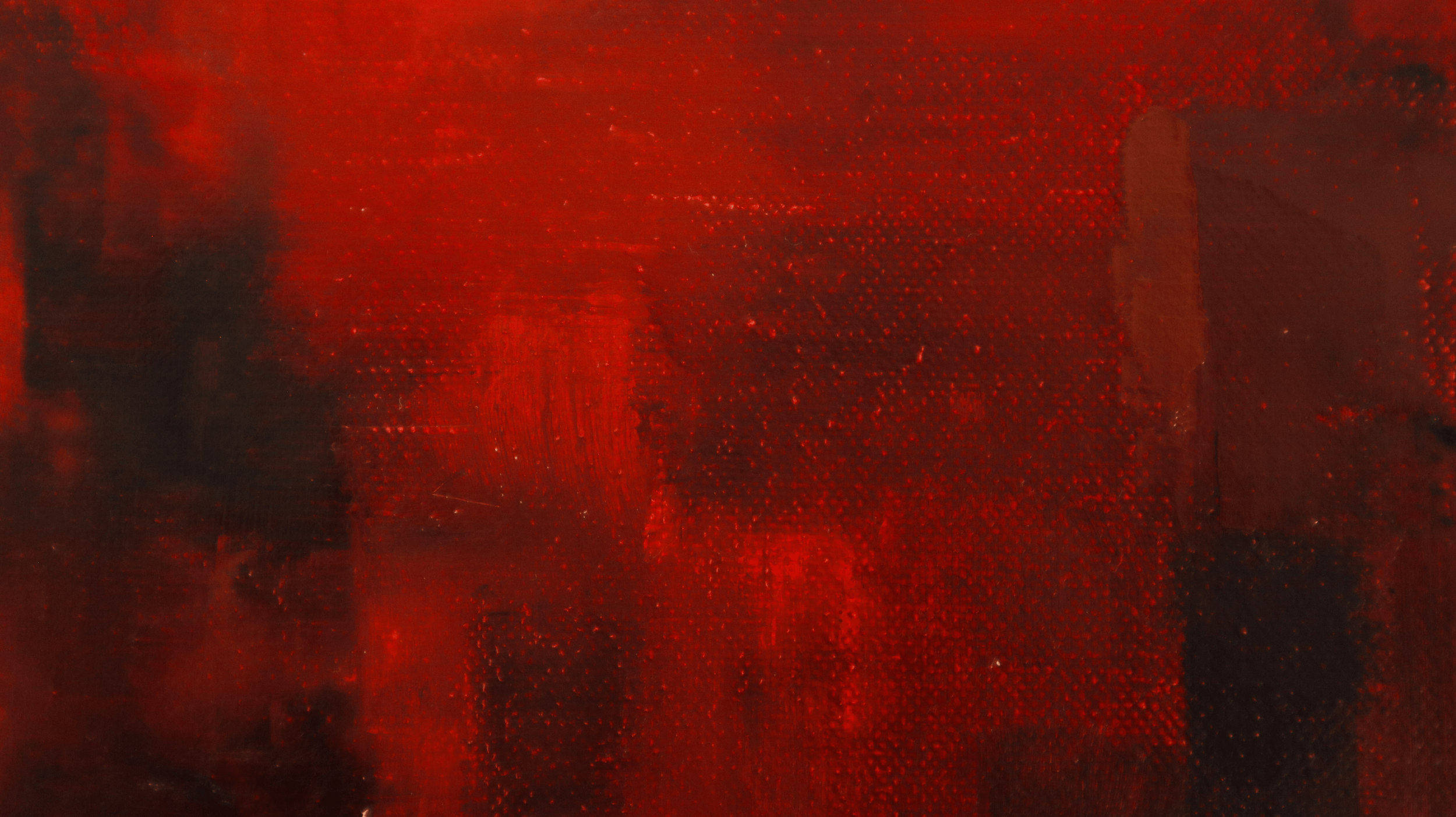 Close-up of red abstract oil painting showing details of the artwork