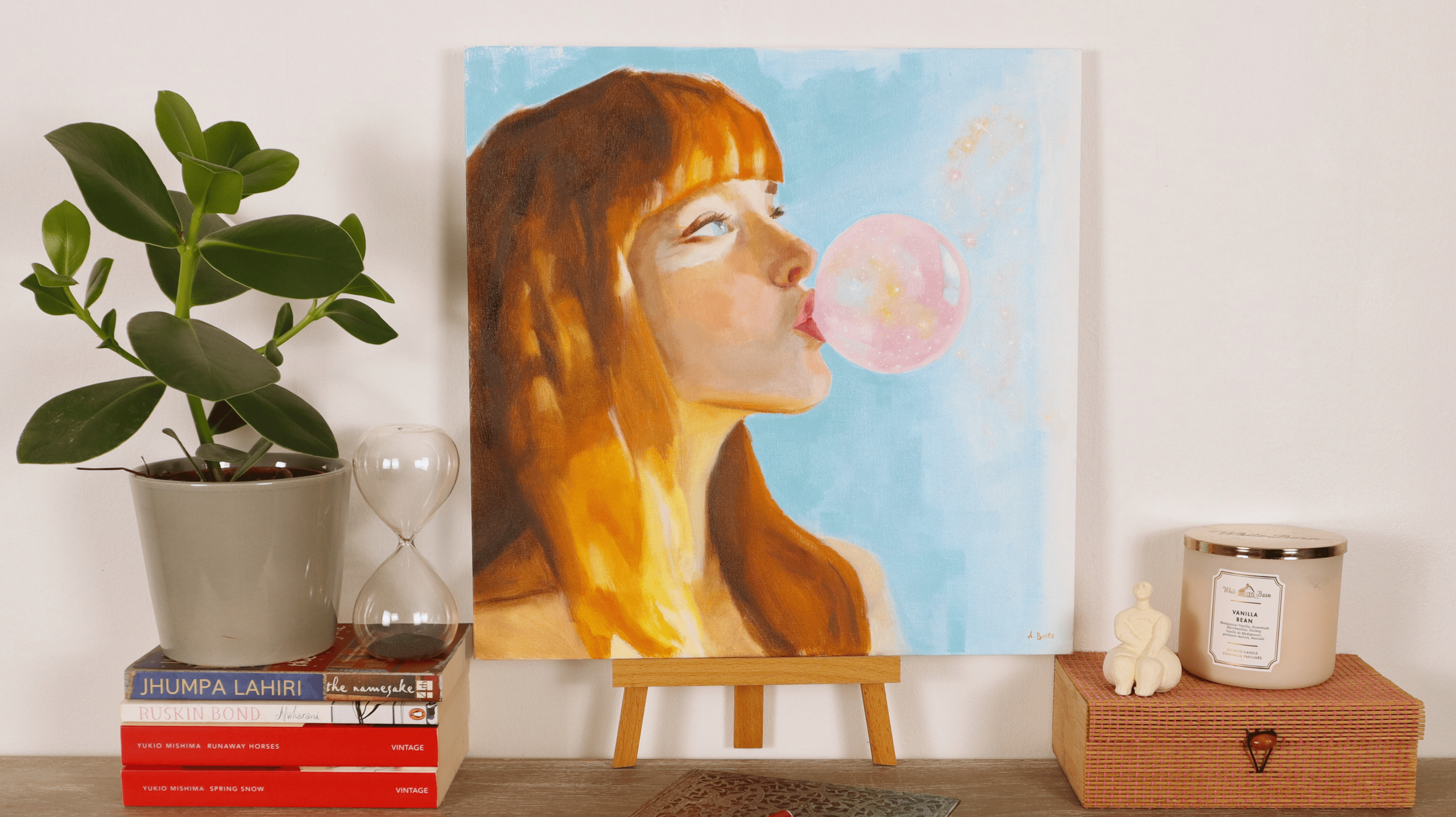 Figurative oil painting displayed in a modern interior, showing a girl blowing a luminous bubble gum