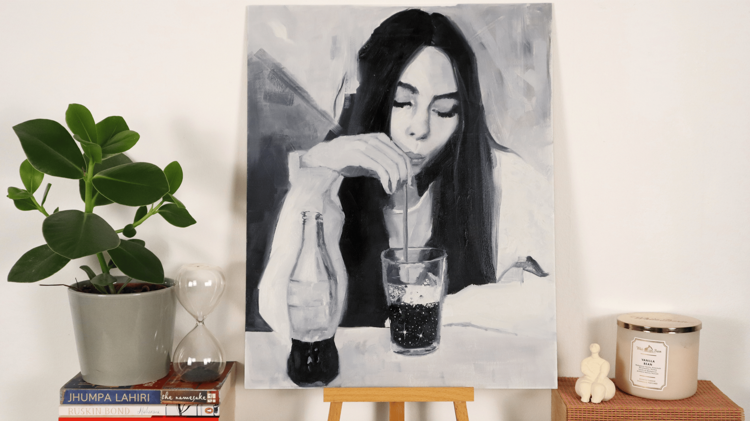 Monochrome figurative oil painting displayed in a contemporary interior setting