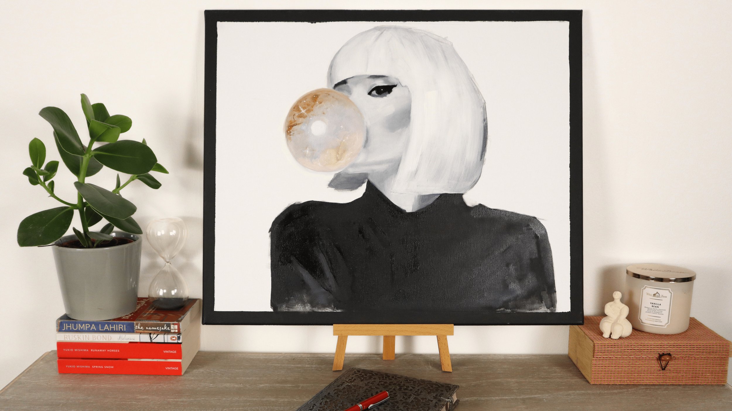 Contemporary figurative painting displayed in a modern interior setting