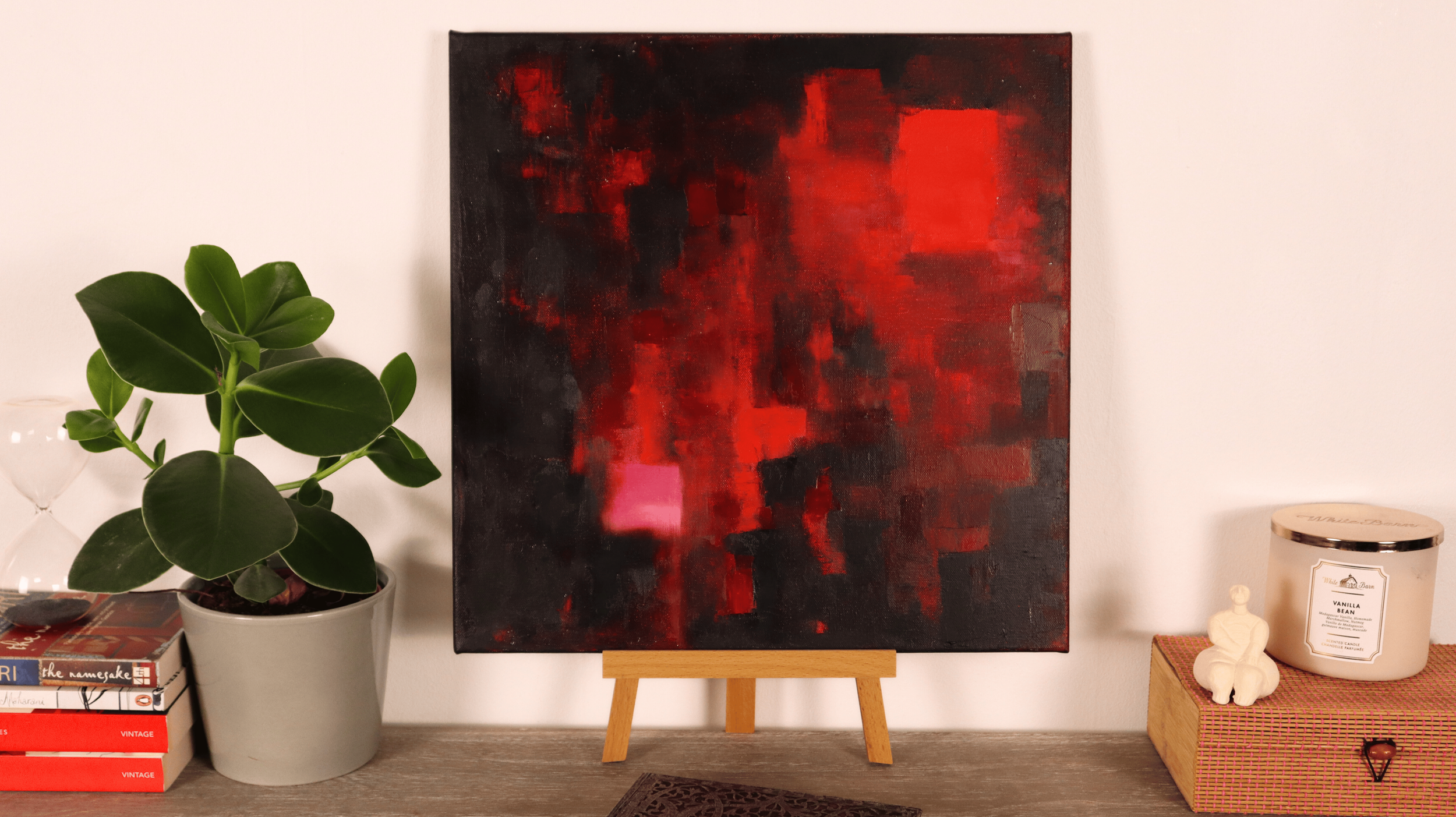 Red abstract oil painting displayed in a contemporary interior