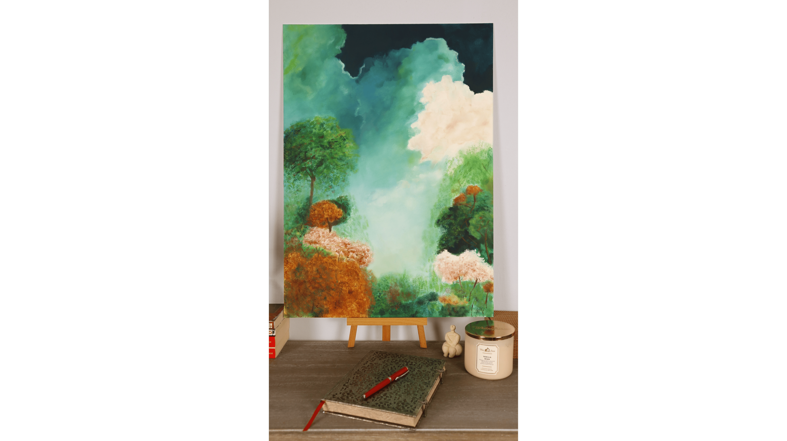 “Dream Garden,” a semi-abstract landscape painting displayed in a modern interior, featuring misty trees and a glowing sky.