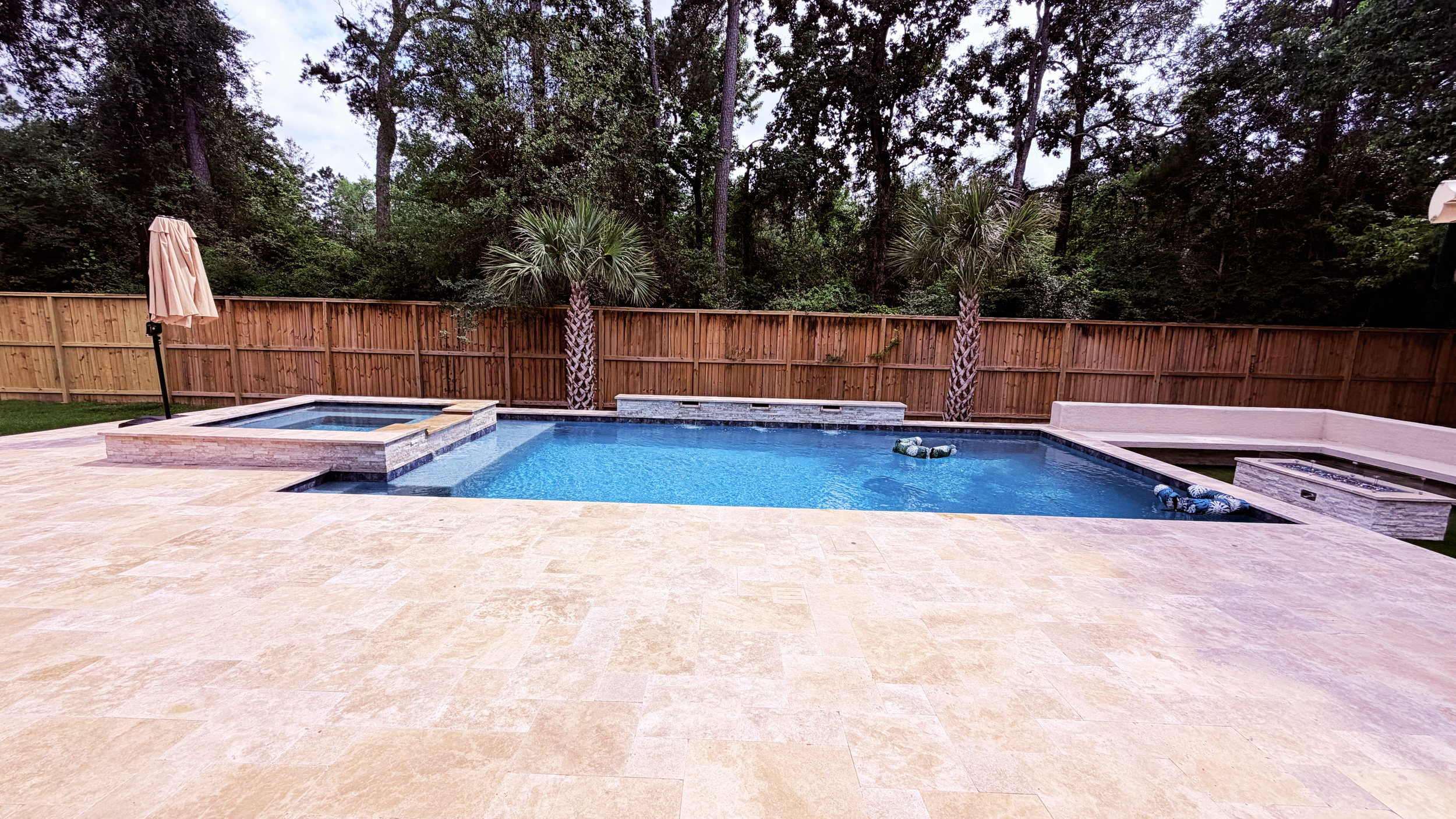 Walnut travertine deck and 7x7 spa in Sterling Ridge, The Woodlands, TX
