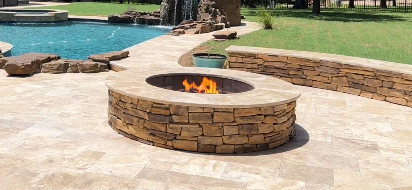 Custom firepit with splitface veneer in Magnolia, TX