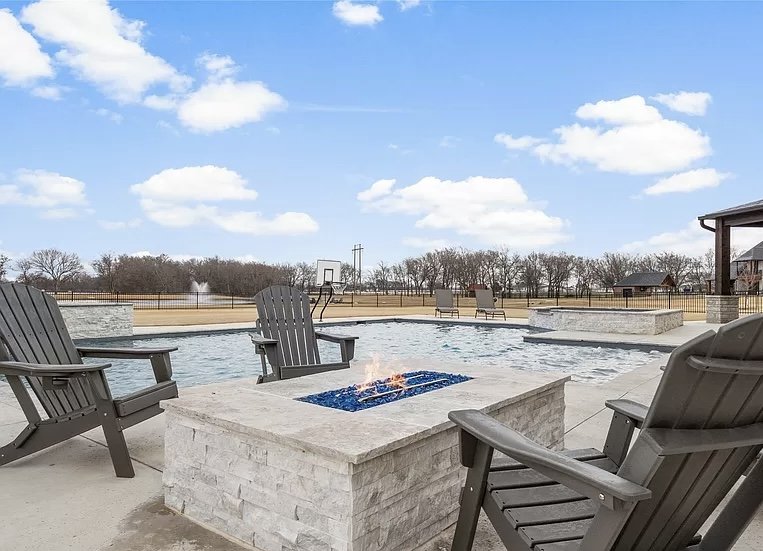 Custom gunite pool and travertine deck built in Fulshear, TX