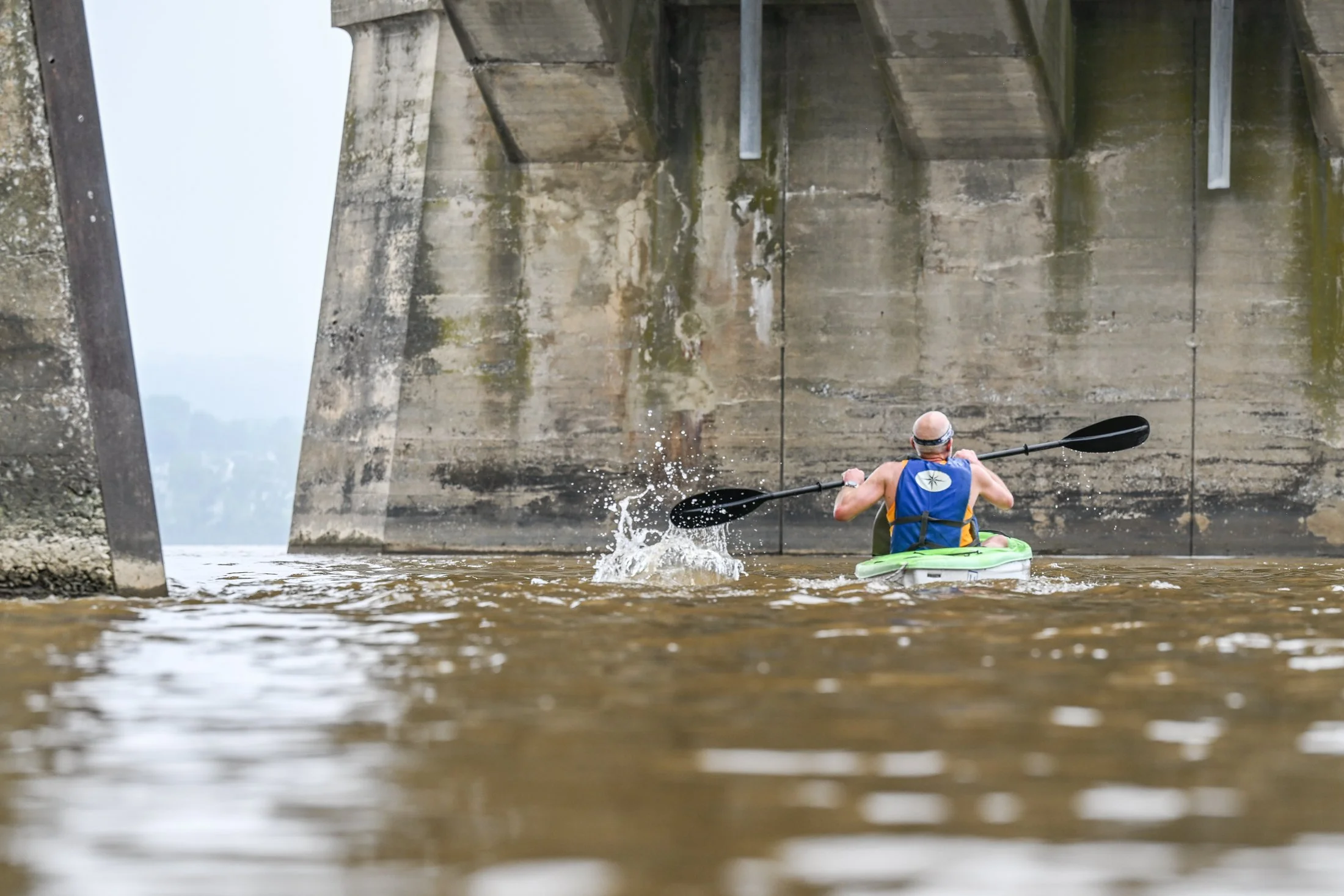 A kayak competitor fights a strong current on the Susquehanna River crossing during Riverfest on Jun. 28th, 2025. The annual race celebrates "Burning the Bridge" to help slow Confederate soldier progress during the Civil War.