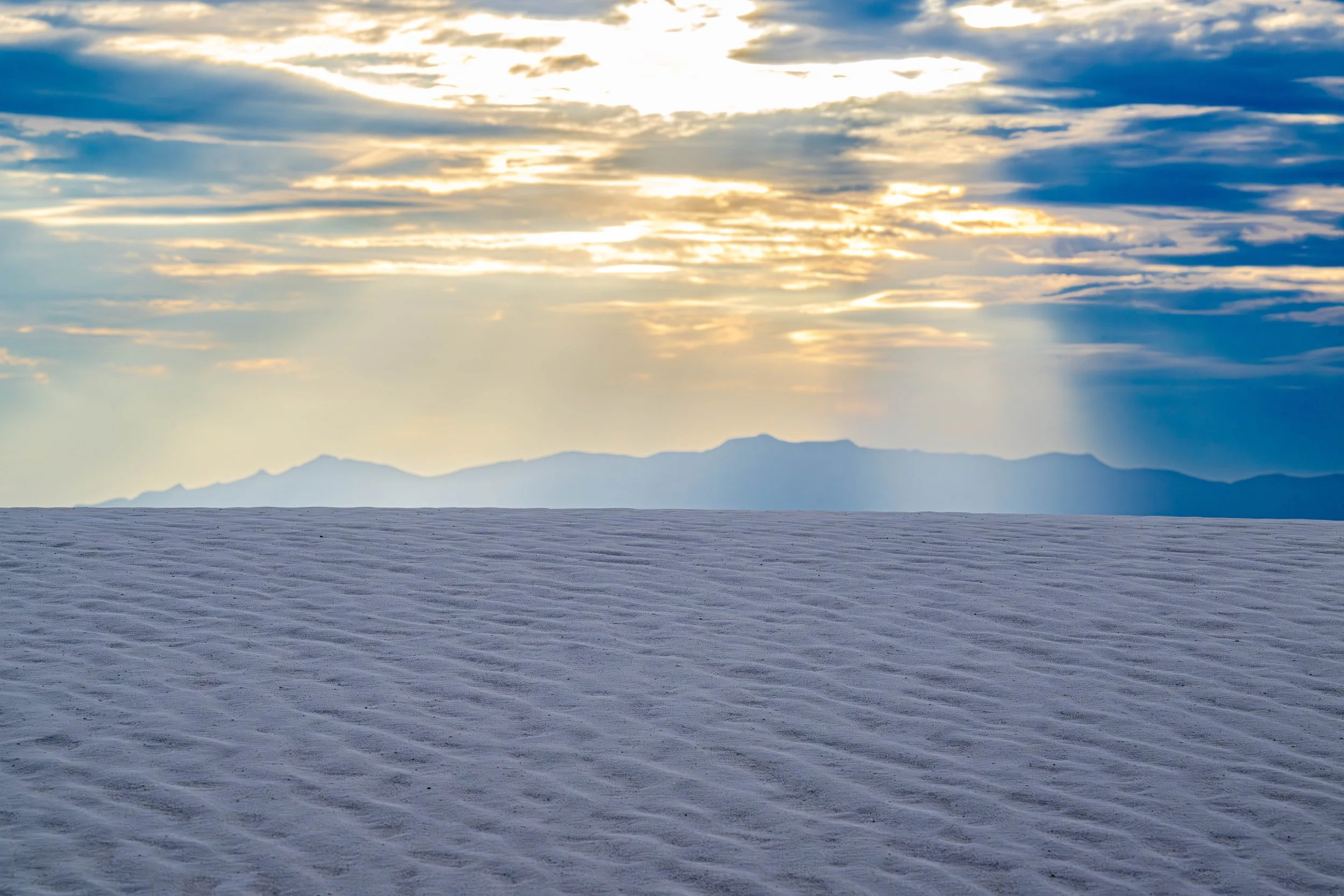 White Sands Dune with sun rays hitting the gypsum at sunset