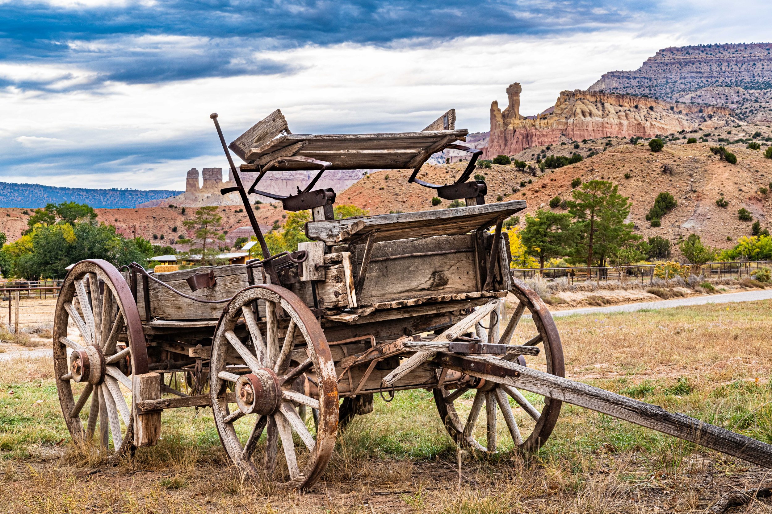 An old wagon and Chimney Rock at Ghost Ranch, New Mexico, USA