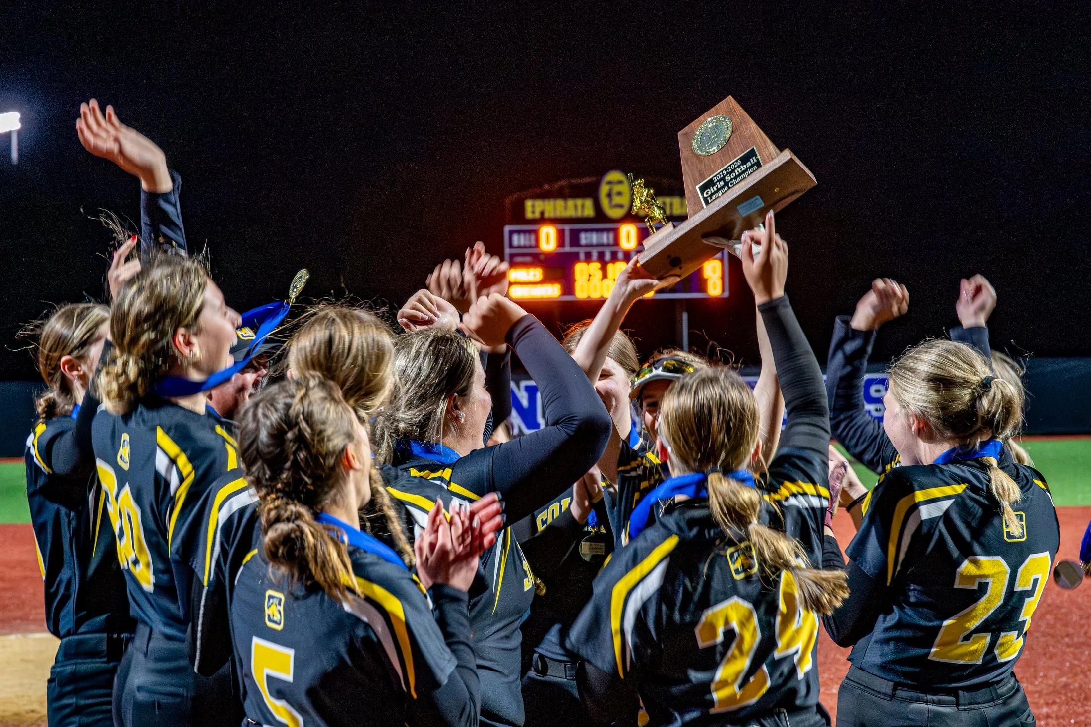 Solanco High School softball players raise their trophy after winning the championship on Thursday, May 14th 2026. Solanco High School defeated Lancaster Catholic 10-0 to win the title.